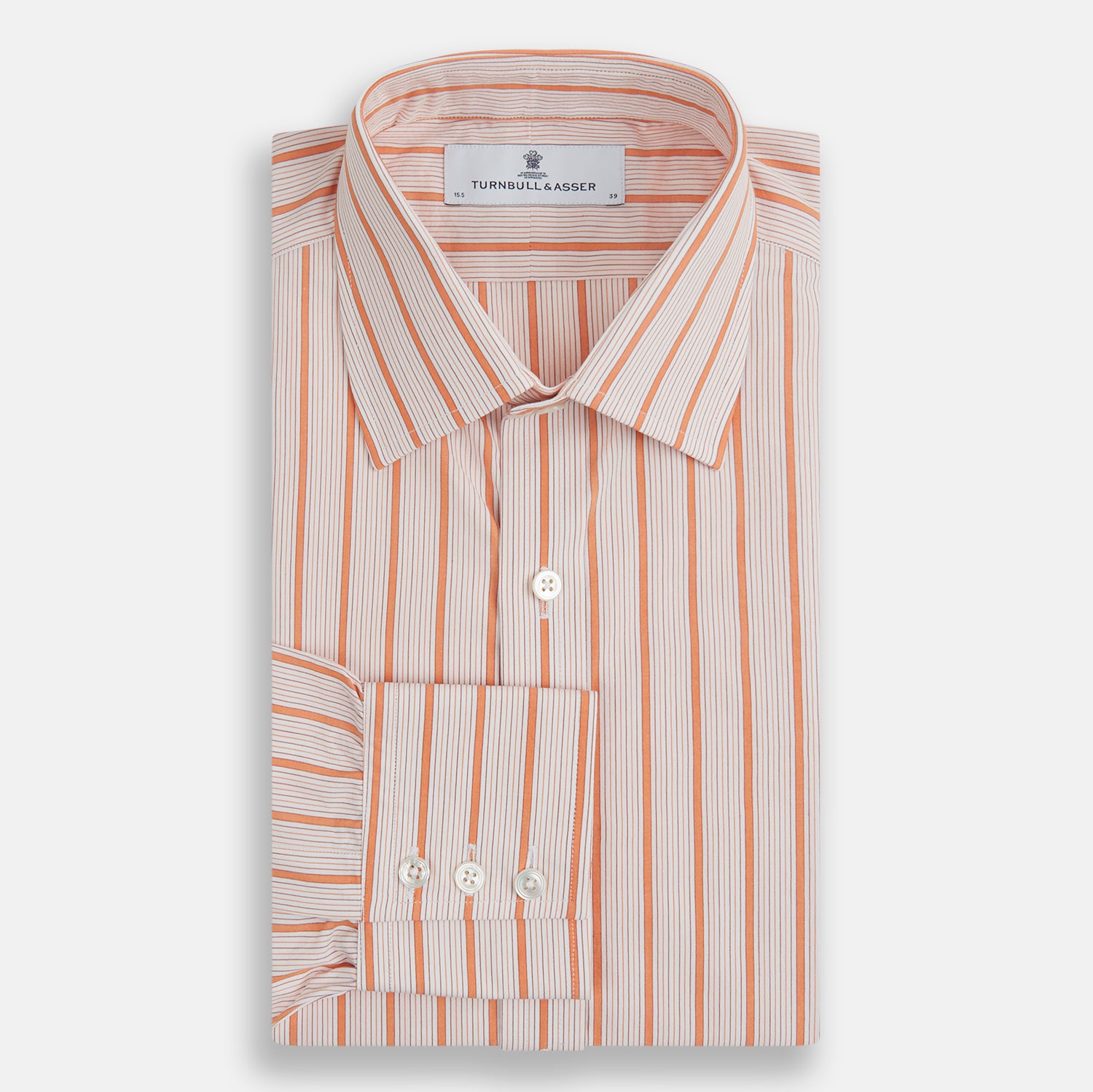 Image 4 of product The Orange Graph Overlay Check Mayfair Shirt by Turnbull & Asser is a long-sleeved organic cotton button-up with orange and white stripes, a collar, and wide cuffs—ideal for elevating your wardrobe. Shown against a white background.