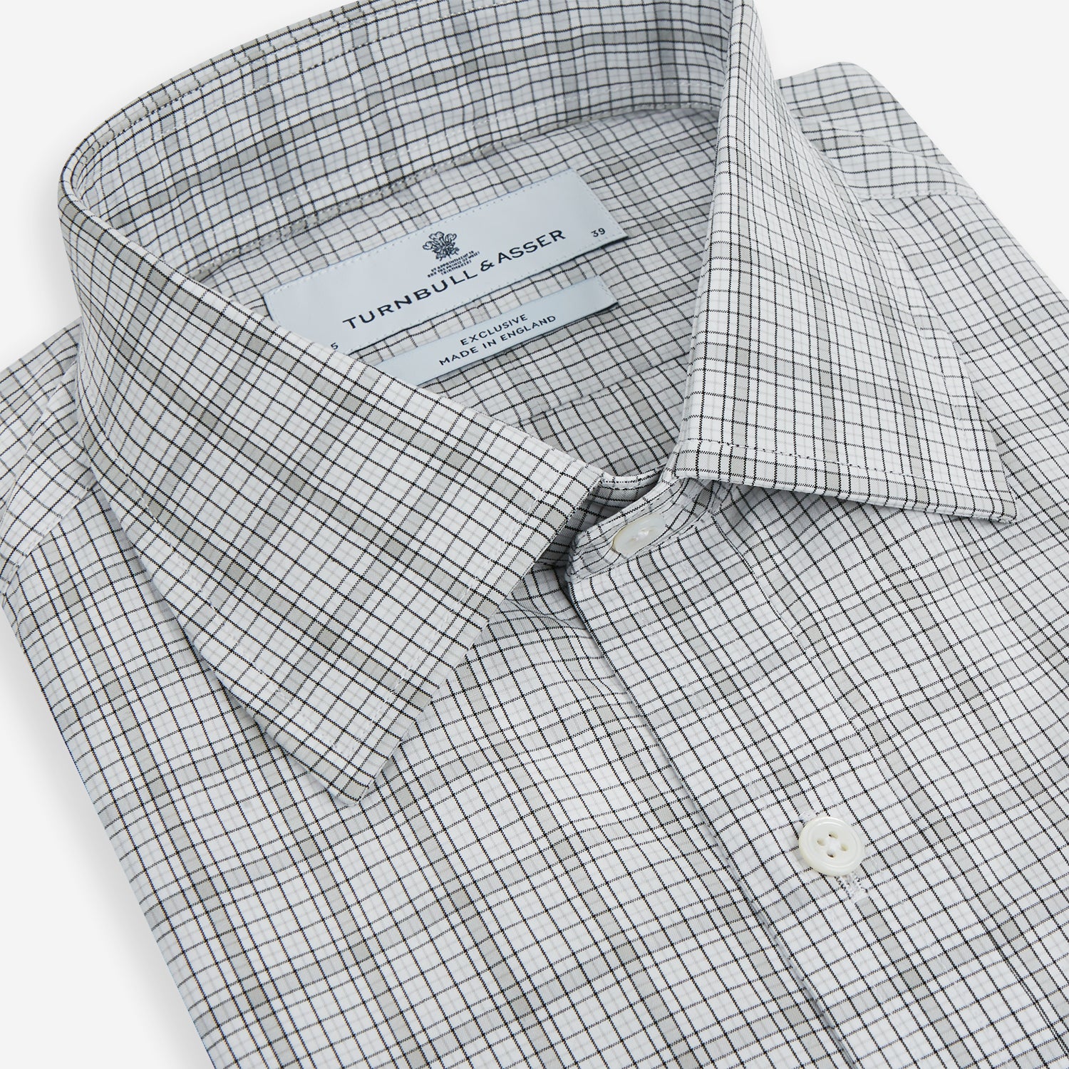 Image 2 of product The Turnbull & Asser Grey Fine Multi Graph Check Mayfair Shirt features a breathable cotton fabric, classic T&A collar, white buttons, and a subtle plaid pattern, displayed on a white background.