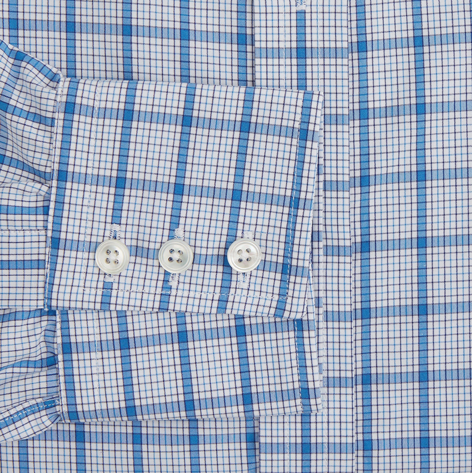 Image 3 of product The Turnbull & Asser Blue Graph Overlay Check Mayfair Shirt features long sleeves, a spread collar, buttoned cuffs, and a blue and white plaid pattern, shown against a plain white background.
