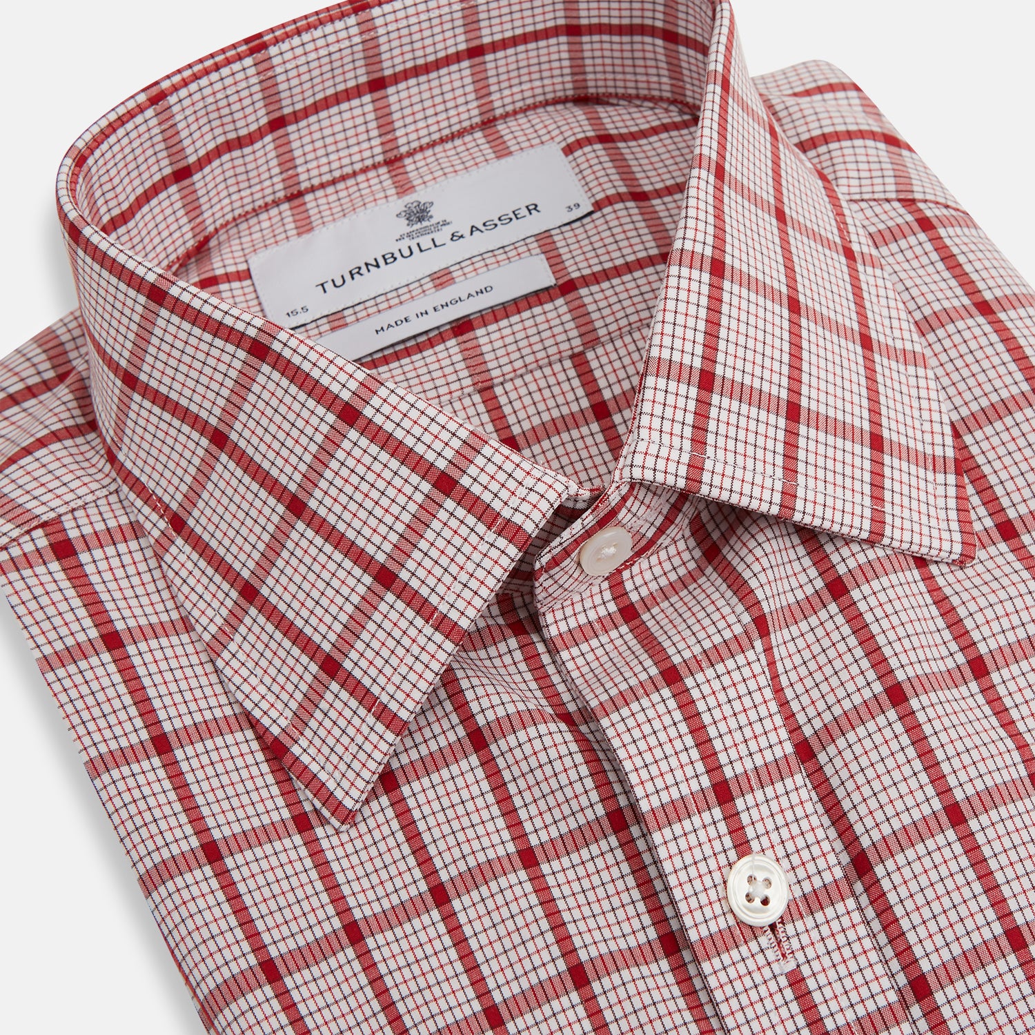 Image 2 of product The Red Graph Overlay Check Mayfair Shirt by Turnbull & Asser is a long-sleeved, button-up shirt with a white base and red check pattern, featuring a collar and buttoned cuffs. Displayed on a plain white background.