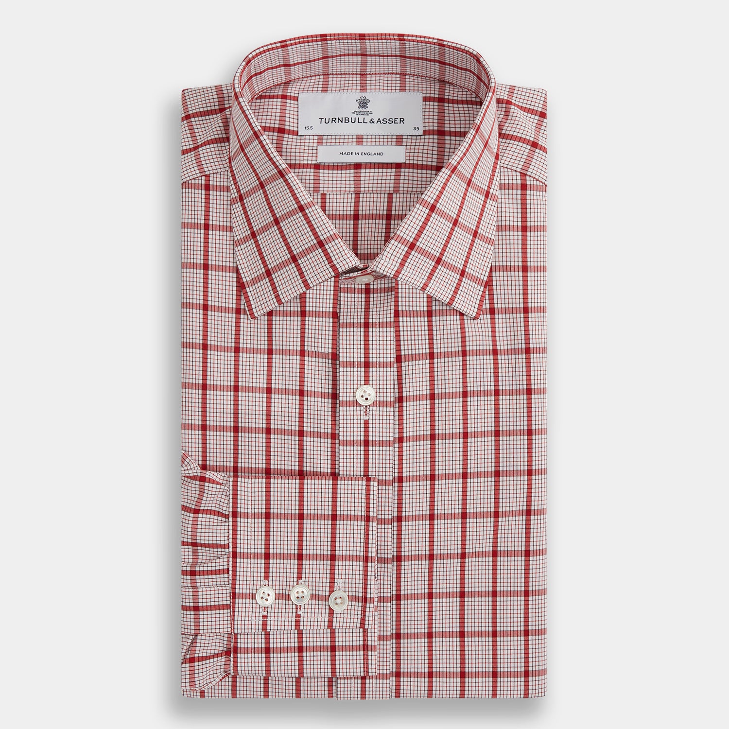 Image 4 of product The Red Graph Overlay Check Mayfair Shirt by Turnbull & Asser is a long-sleeved, button-up shirt with a white base and red check pattern, featuring a collar and buttoned cuffs. Displayed on a plain white background.