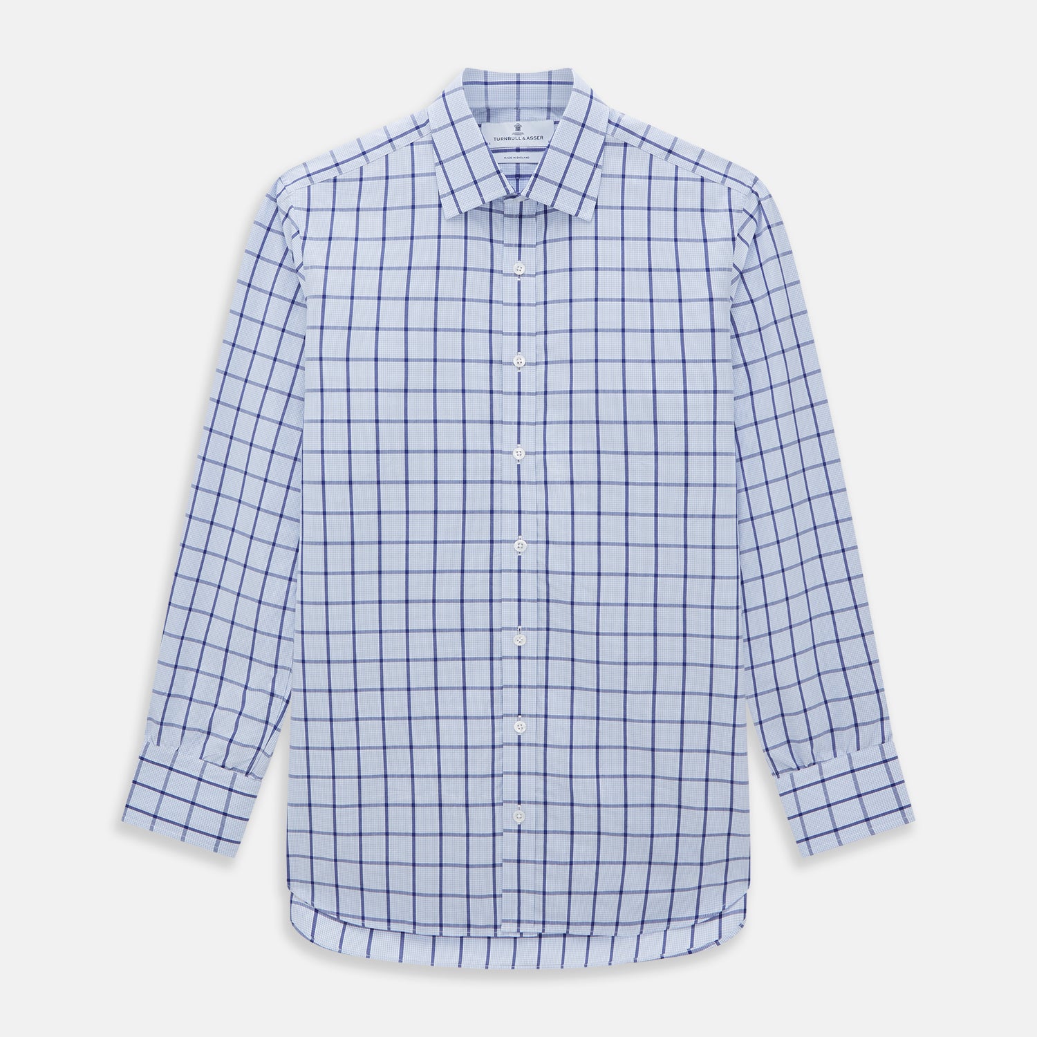 Image 1 of product The Turnbull & Asser Navy Blue Windowpane Check Mayfair Shirt is a long-sleeved, organic cotton, button-up dress shirt with a classic collar and buttoned cuffs—white fabric with navy windowpane checks, ideal for any wardrobe capsule.