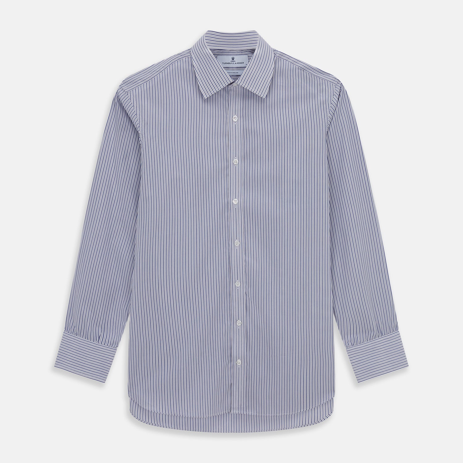 Image 1 of product The Dark Blue Track Stripe Mayfair Shirt by Turnbull & Asser is a long-sleeve, button-up Egyptian cotton shirt with a classic collar and thin blue and white stripes, laid flat on a white background.