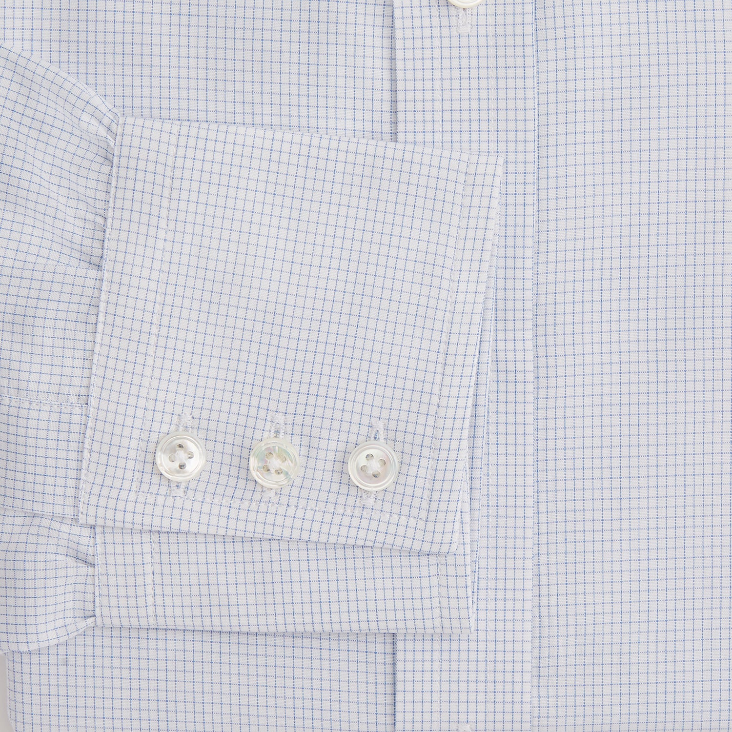 Image 3 of product The Turnbull & Asser Blue Fine Graph Check Mayfair Shirt, made from breathable cotton, features long sleeves, a T&A collar, white buttons, and buttoned cuffs, displayed flat on a white background.