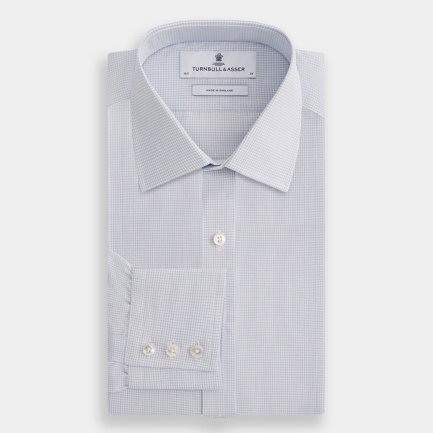 Image 4 of product The Turnbull & Asser Blue Fine Graph Check Mayfair Shirt, made from breathable cotton, features long sleeves, a T&A collar, white buttons, and buttoned cuffs, displayed flat on a white background.