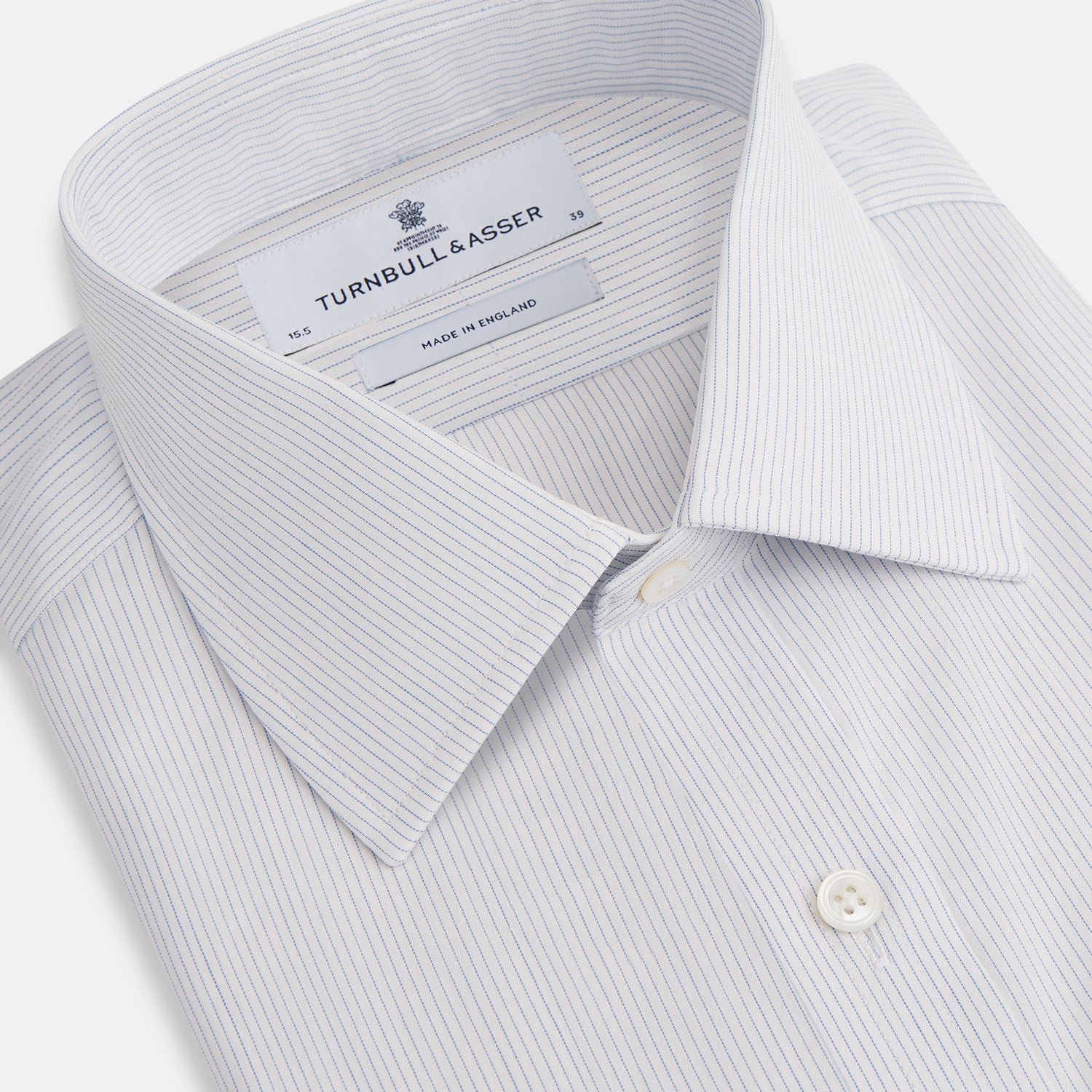 Image 2 of product The Blue Pencil Stripe Mayfair Shirt by Turnbull & Asser features light blue stripes, long sleeves, a classic T&A collar, and buttoned cuffs, displayed on a plain white background.