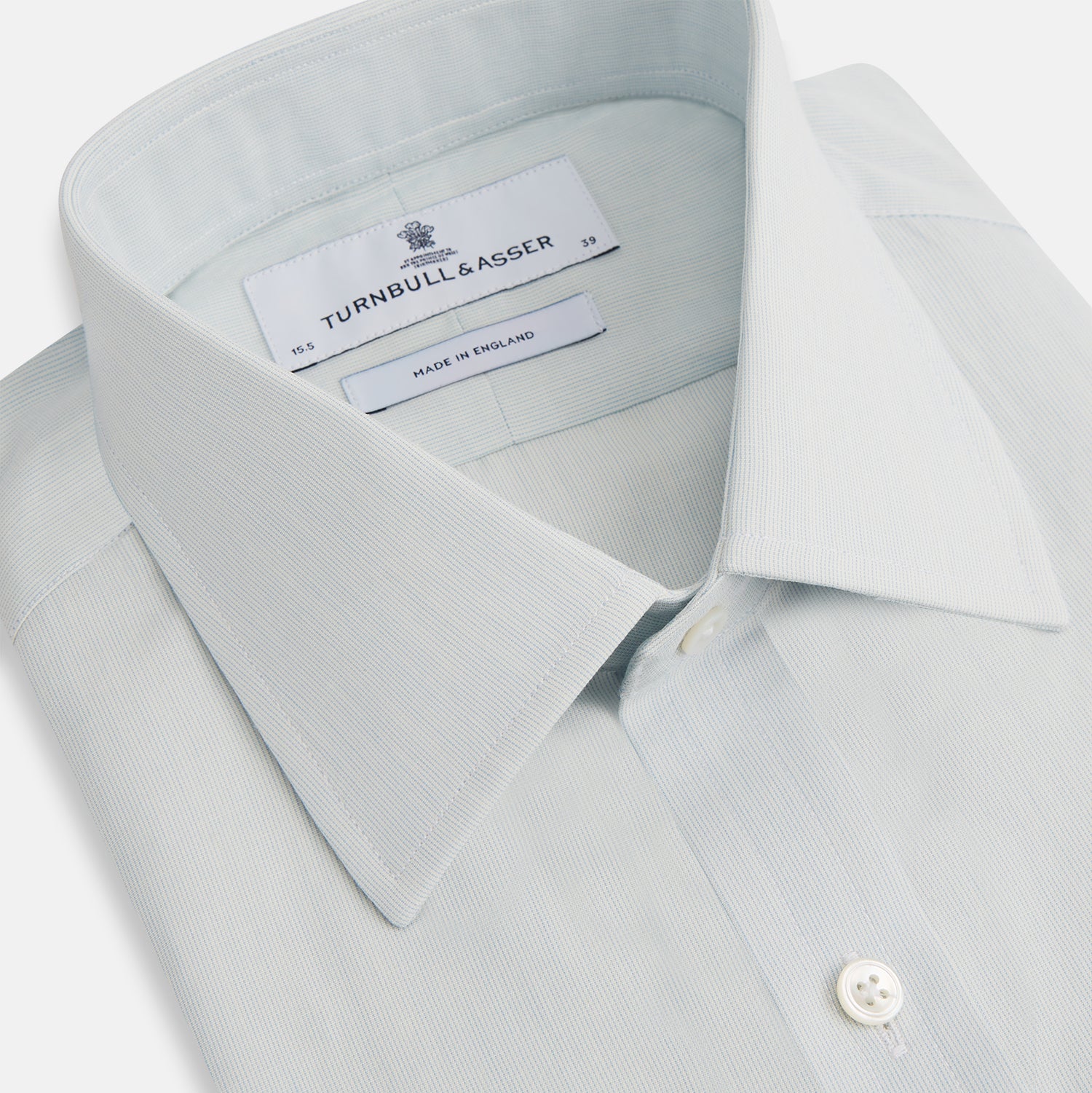 Image 2 of product Pale Blue Pencil Stripe Mayfair Shirt by Turnbull & Asser featuring a classic collar, white buttons, and cuffed long sleeves, displayed flat on a white background.