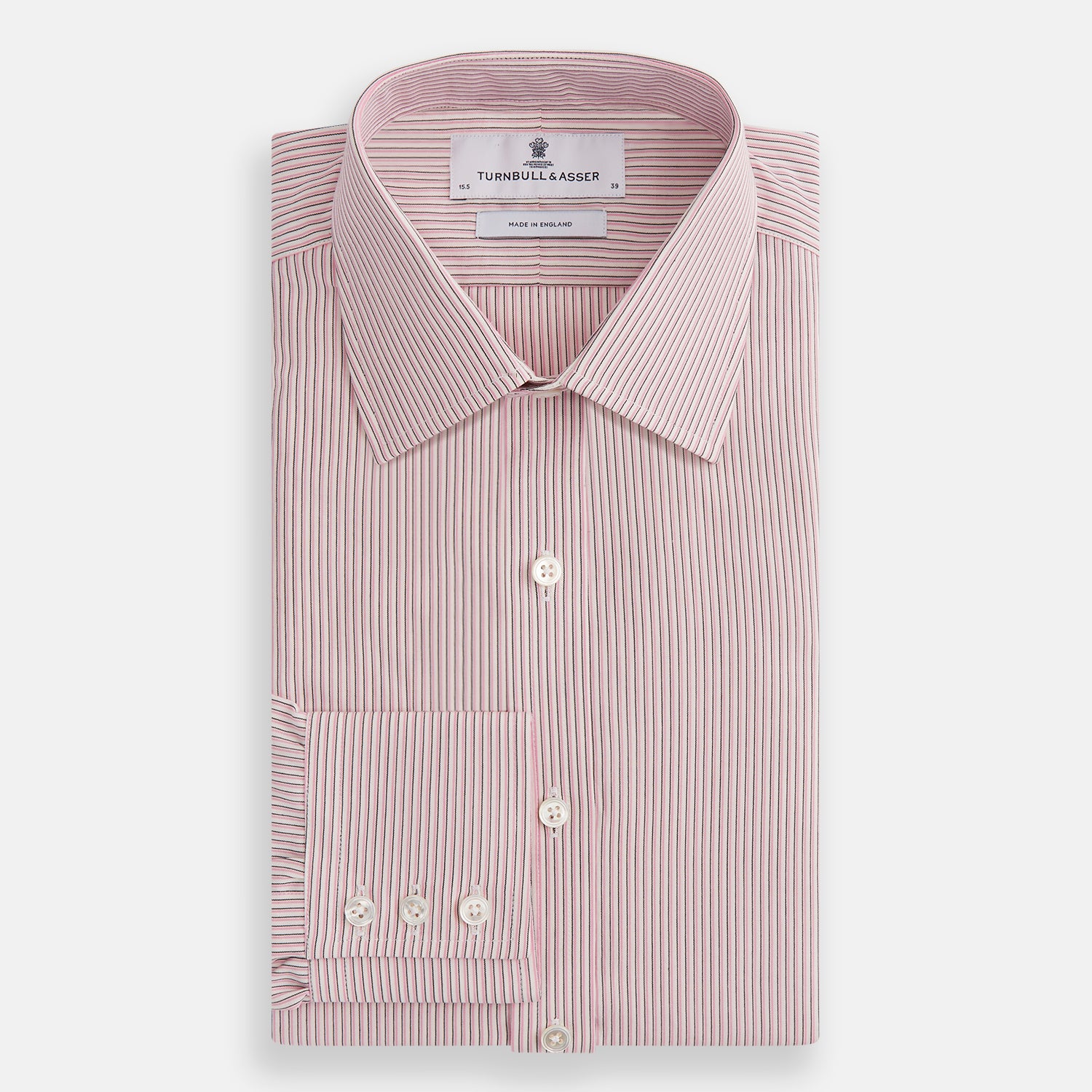Image 4 of product The Turnbull & Asser Pink Fine Shadow Stripe Mayfair Shirt is a long-sleeved button-up with a classic T&A collar, crafted from pure cotton and featuring thin pink and white vertical stripes, shown on a plain white background.