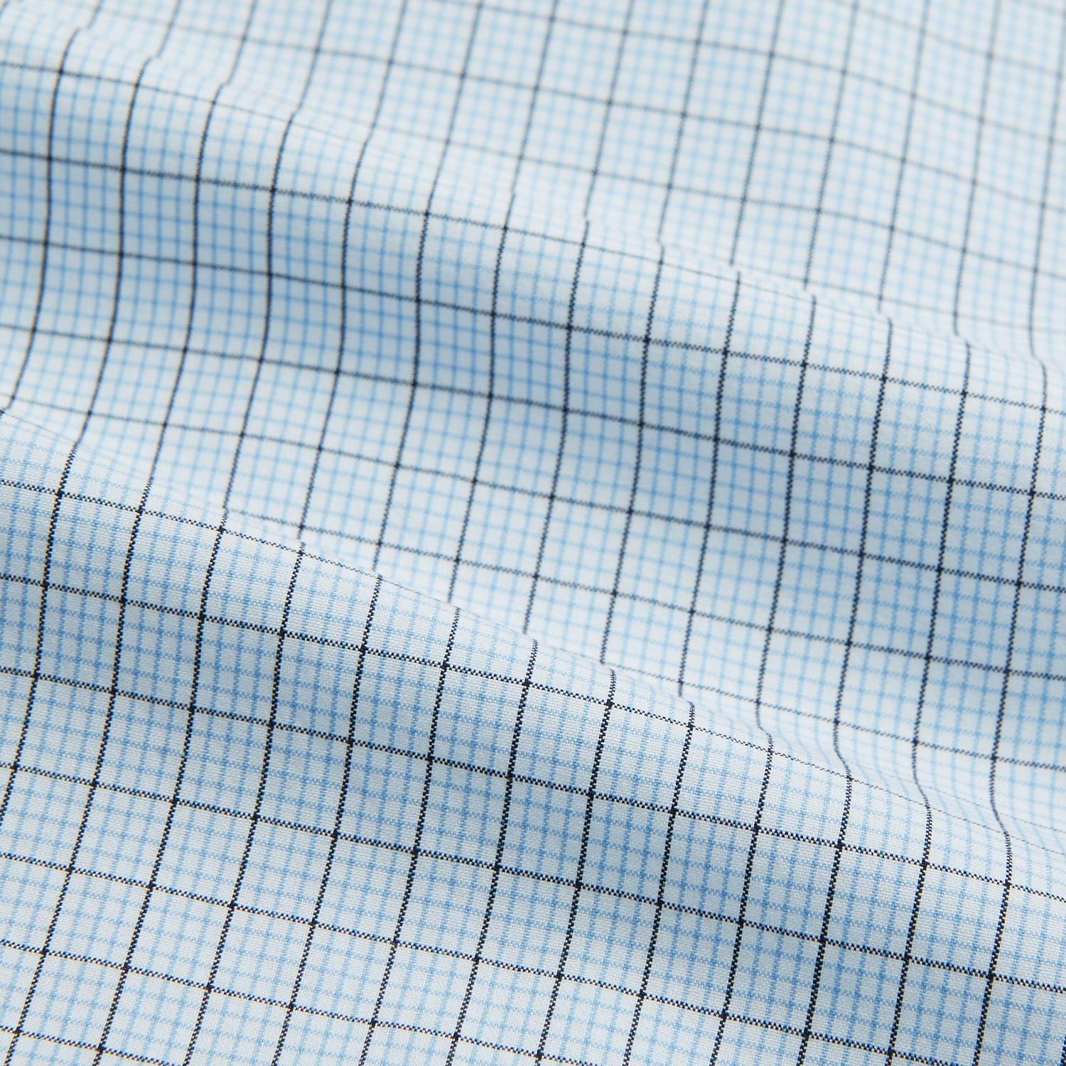 Image 5 of product The Blue Multi Graph Check Mayfair Shirt by Turnbull & Asser features long sleeves, a classic T&A collar, chest pocket, and is crafted from breathable cotton, shown on a white background.