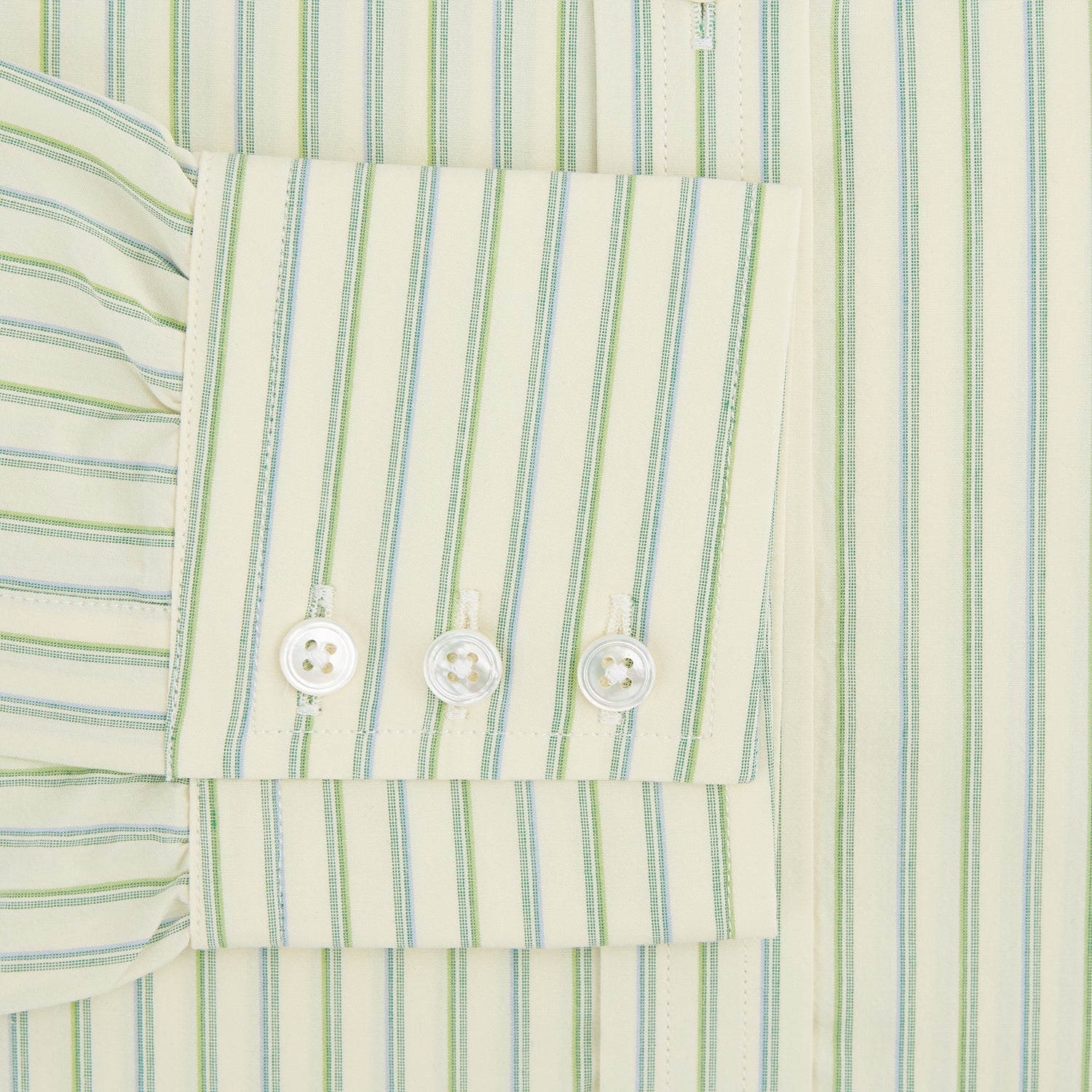 Image 3 of product The Green Double Stripe Mayfair Shirt by Turnbull & Asser features light green and white vertical stripes, long sleeves, a T&A collar, and buttoned cuffs. Made from organic cotton and shown laid flat on a white background.