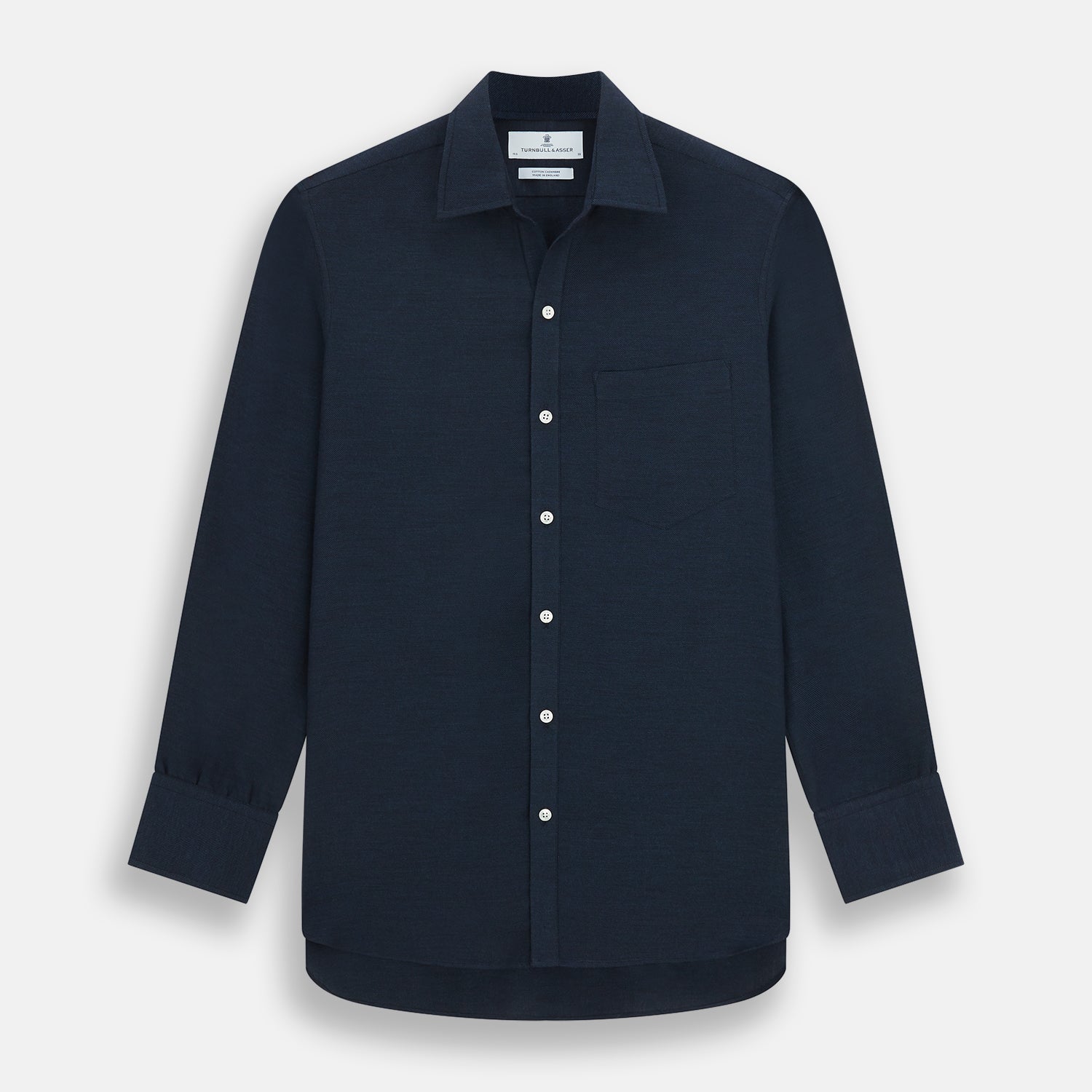 Image 1 of product The Turnbull & Asser Navy Cotton Cashmere Chelsea Shirt features long sleeves, a classic collar, front chest pocket, and white buttons, shown laid flat on a white background.