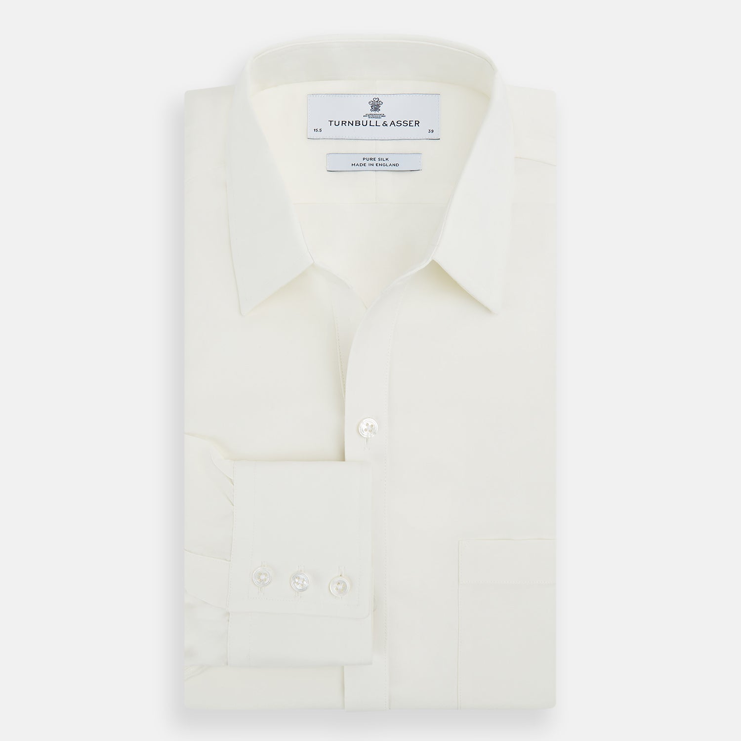Image 5 of product The Turnbull & Asser Cream Silk Chelsea Shirt is an elegant white long-sleeve, button-up silk shirt with a single chest pocket, shown against a plain white background.