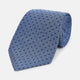 The Turnbull & Asser Navy and Blue Micro Dot Silk Tie is shown rolled up, featuring a steel blue color with small navy blue dots, on a plain white background.