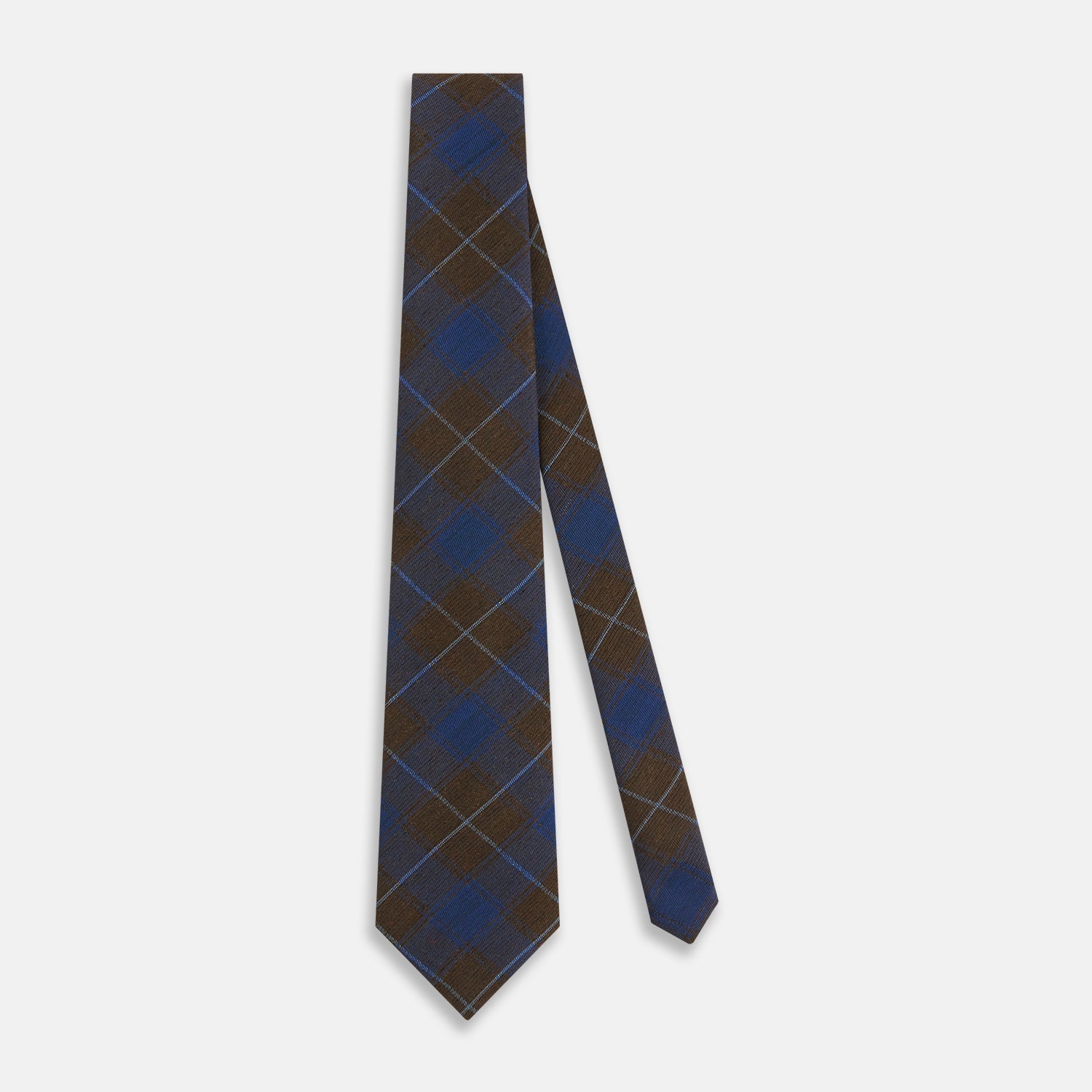 Image 2 of product The Turnbull & Asser Blue and Brown Tartan Silk Blend Tie, rolled up to show intersecting patterns, is displayed against a plain white background.