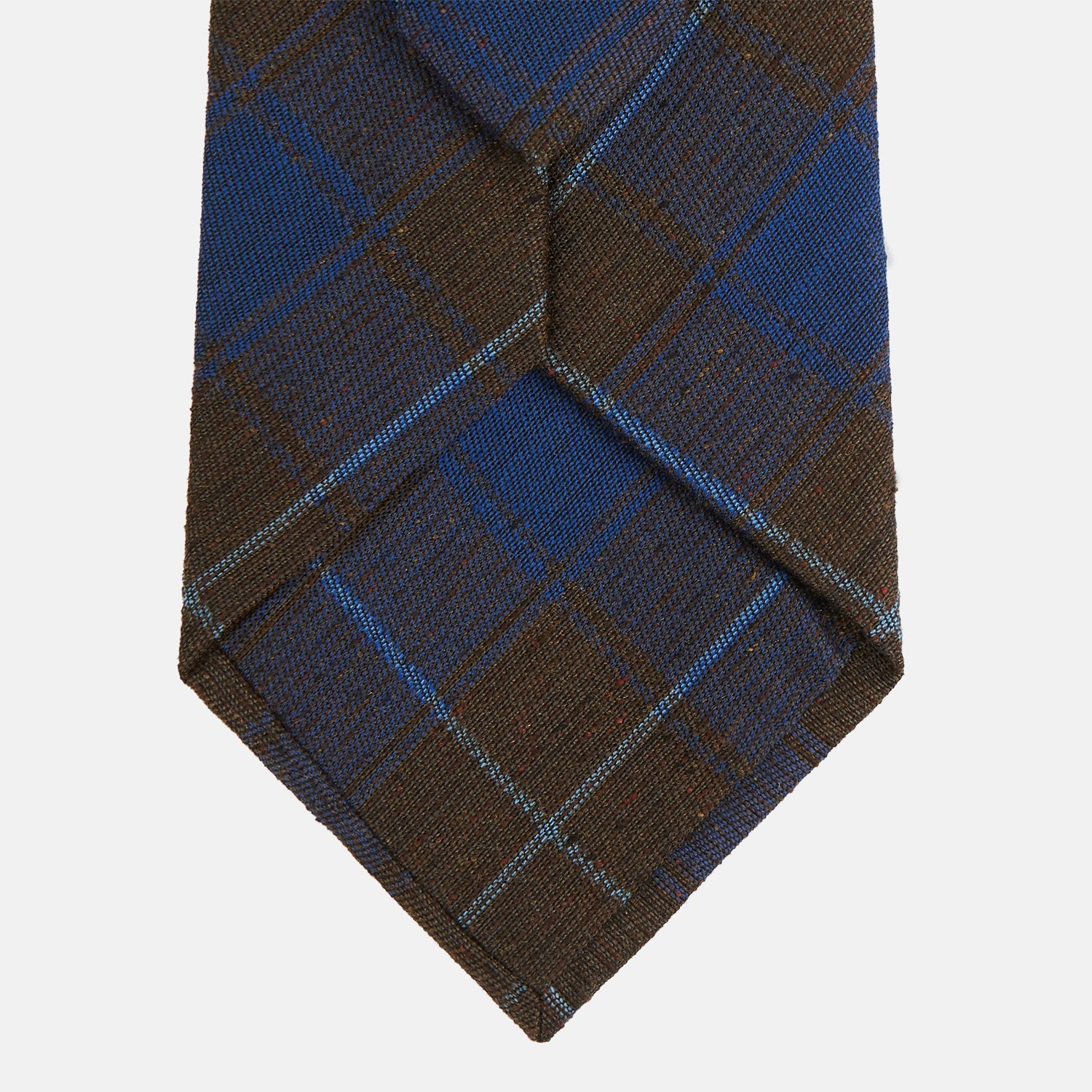 Image 3 of product The Turnbull & Asser Blue and Brown Tartan Silk Blend Tie, rolled up to show intersecting patterns, is displayed against a plain white background.