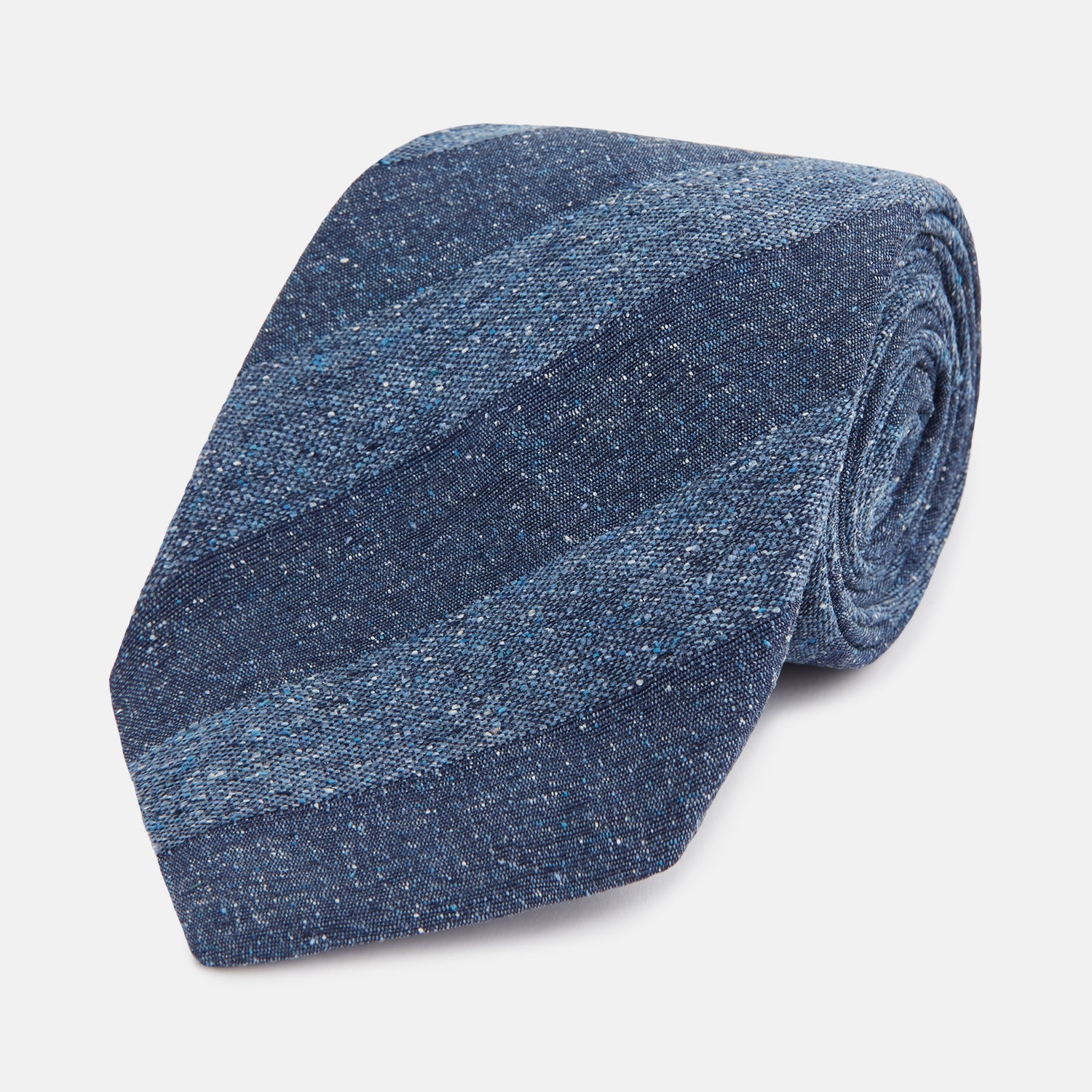 Image 1 of product The Turnbull & Asser Blue Block Stripe Silk Tie, featuring a refined striped pattern, is elegantly showcased rolled up against a plain white background.