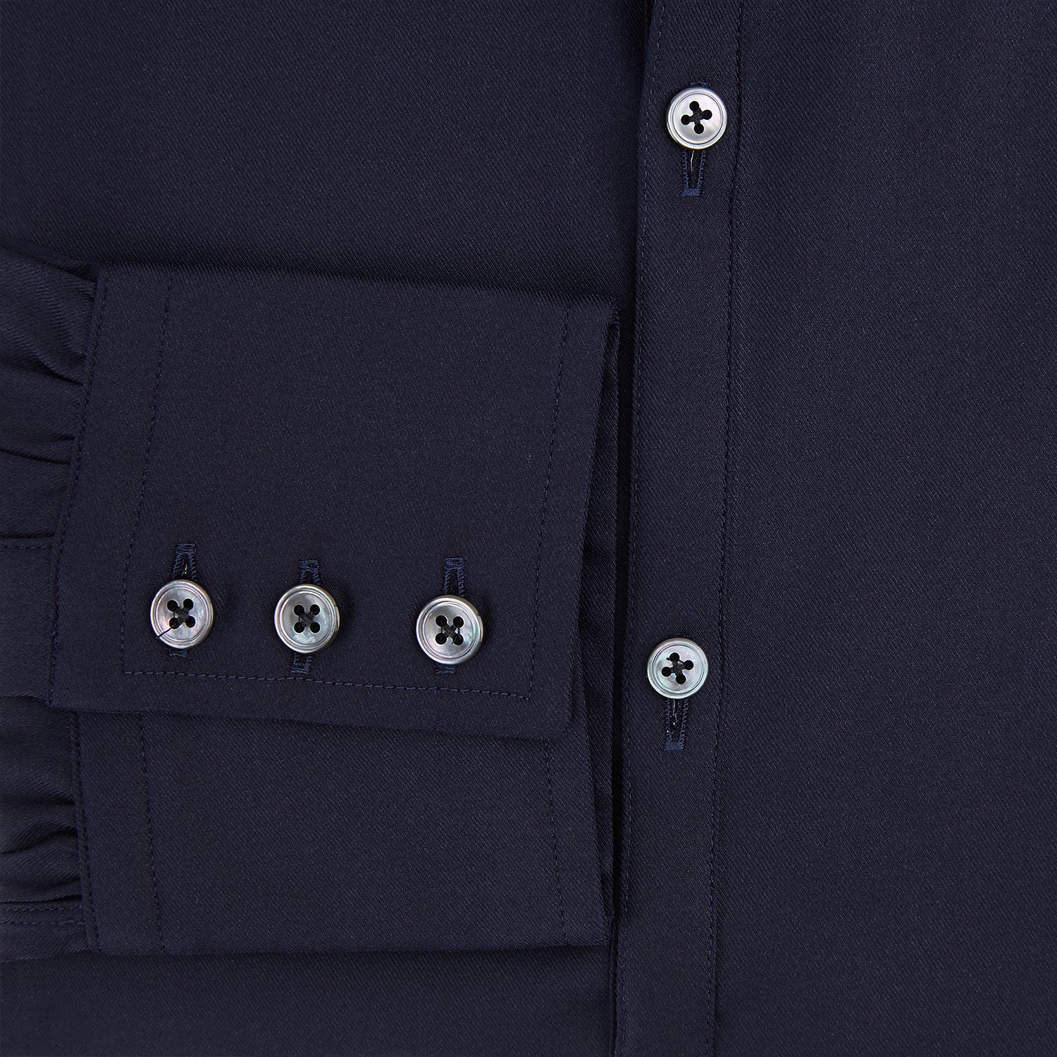 Image 4 of product The Navy Twill Windsor Shirt by Turnbull & Asser features long sleeves, a button-up front, British craftsmanship, and a refined Windsor collar, shown in dark navy on a plain white background.