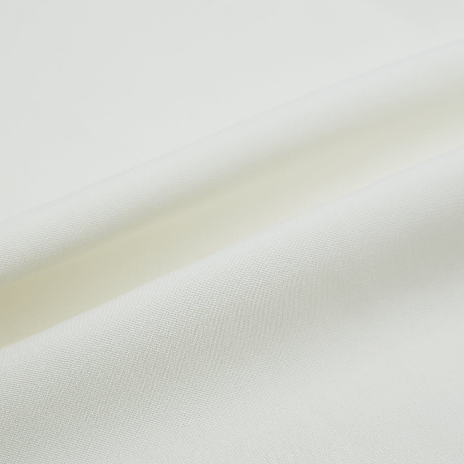 Image 7 of product The Turnbull & Asser Cream Silk Pyjama Set, shown laid flat on a white background, features a long-sleeve button-up top with a chest pocket and matching pants with an elastic drawstring waist—ideal for comfortable loungewear.