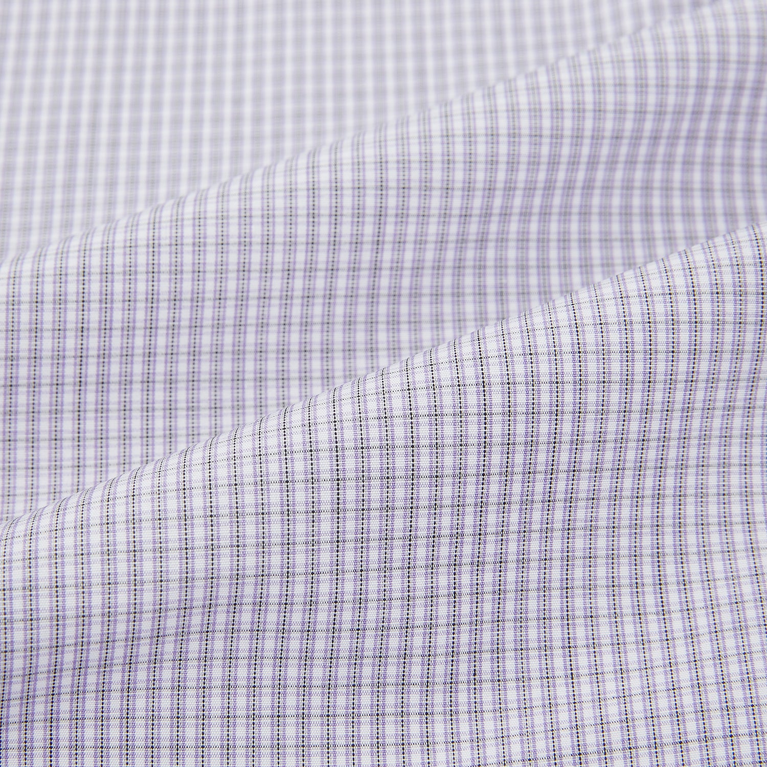 Image 6 of product The Turnbull & Asser Purple Micro Check Mayfair Shirt features long sleeves, button-up front, pointed collar, and buttoned cuffs in a subtle lilac and white check, exemplifying British craftsmanship and displayed on a white background.