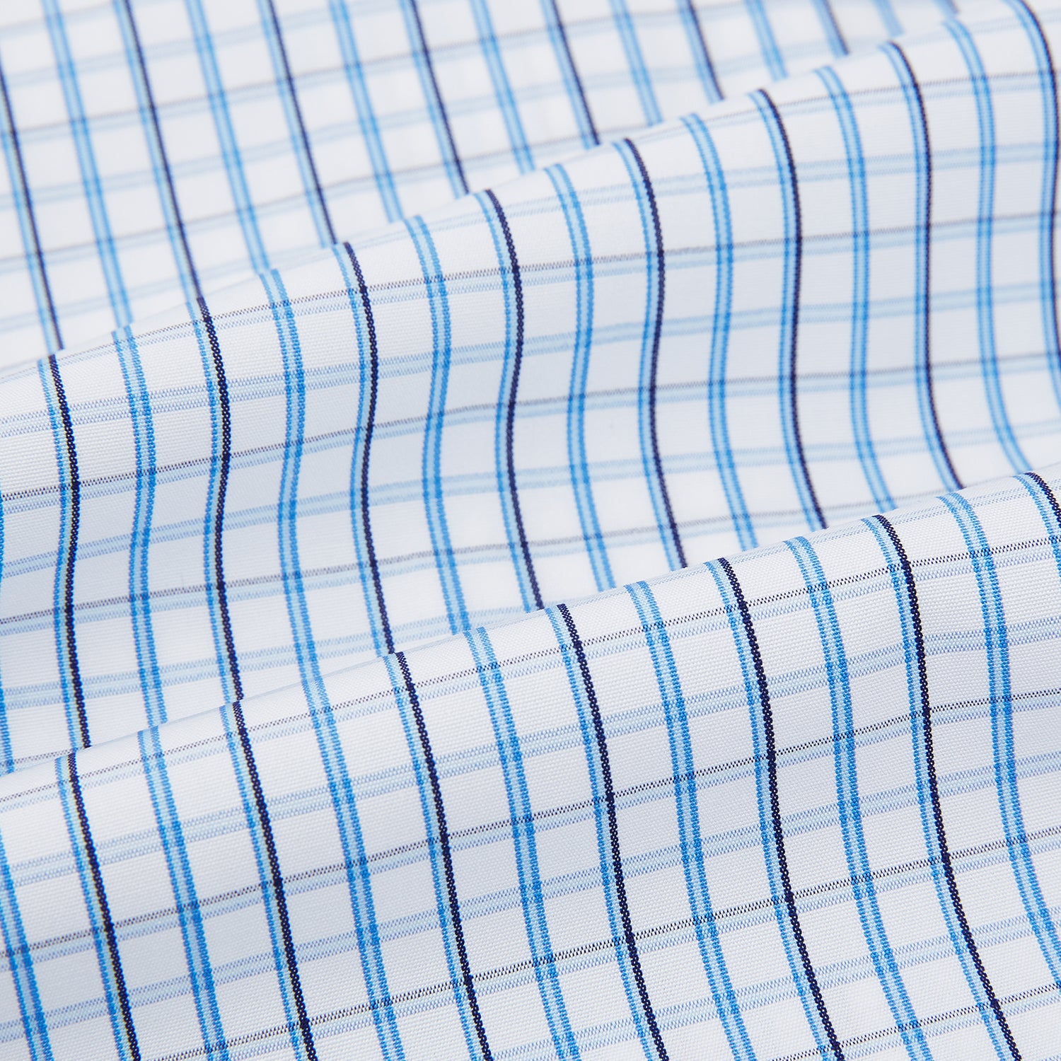 Image 6 of product The Turnbull & Asser Blue and Navy Tattersall Check Mayfair Shirt features long sleeves, a button-up front, and a T&A collar in the classic Mayfair fit, shown flat against a white background.