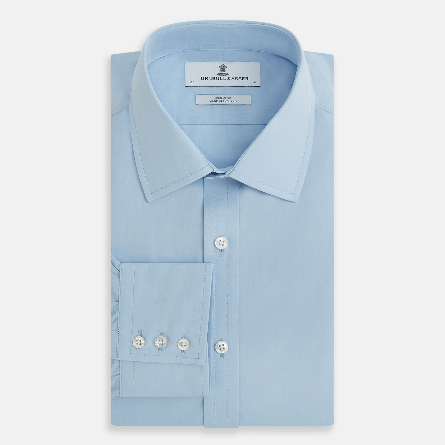 Image 5 of product The Turnbull & Asser Sky Blue Mayfair Shirt is a long-sleeved, collared button-down made from sanforised cotton, shown laid flat on a white background.