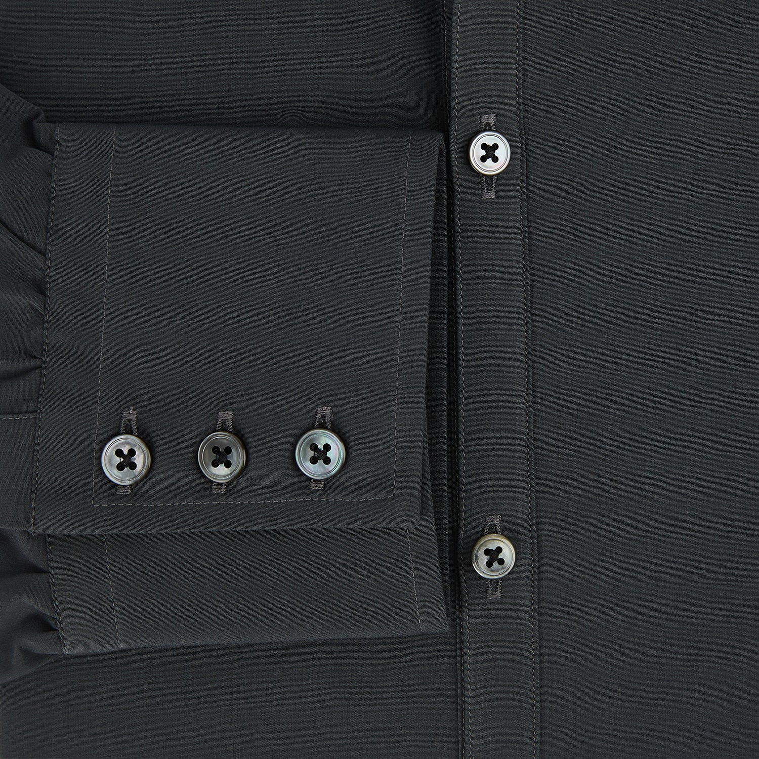 Image 4 of product The CHARCOAL WINDSOR SHIRT by Turnbull & Asser, featuring long sleeves, a button-up front, and a pointed collar, is displayed flat against a white background, reflecting classic British craftsmanship.