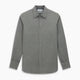 The Pale Charcoal Westminster Shirt by Turnbull & Asser features British craftsmanship with a tailored silhouette, long sleeves, pointed collar, buttoned cuffs, and a solid pale charcoal hue, elegantly shown against a white background.