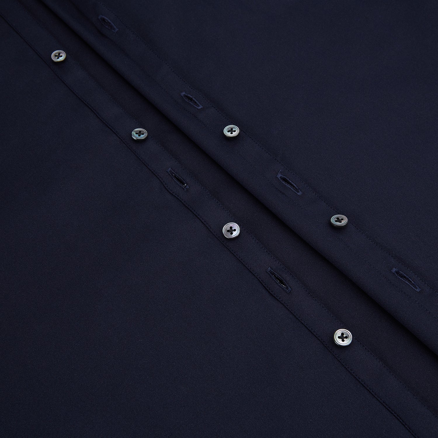 Image 7 of product The Navy Twill Windsor Shirt by Turnbull & Asser features long sleeves, a button-up front, British craftsmanship, and a refined Windsor collar, shown in dark navy on a plain white background.