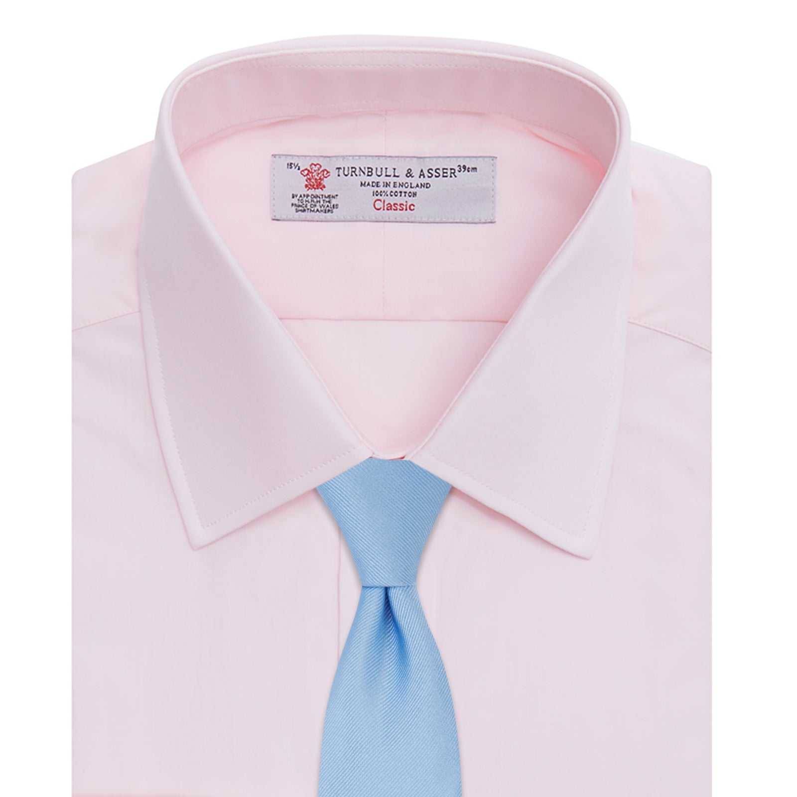 Image 6 of product A neatly folded Pink Cotton Shirt with T&A collar and double cuffs by Turnbull & Asser, featuring a classic design with white buttons and an inner label, displayed on a plain white background.