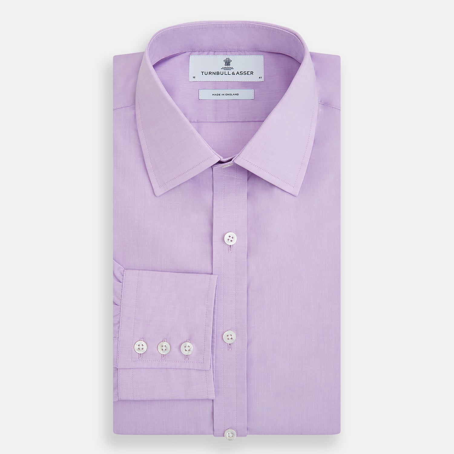 Image 5 of product The Turnbull & Asser Purple Pink Mayfair Shirt is a men's formal, long-sleeve button-up with a classic collar and buttoned cuffs, shown in light purple against a plain white background.
