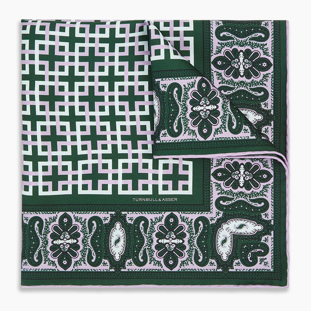 Image 5 of product The Forest Green Square-Patterned and Paisley Silk Pocket Square by Turnbull & Asser features geometric and paisley designs, is handcrafted in England, and has the brand printed near the edge.