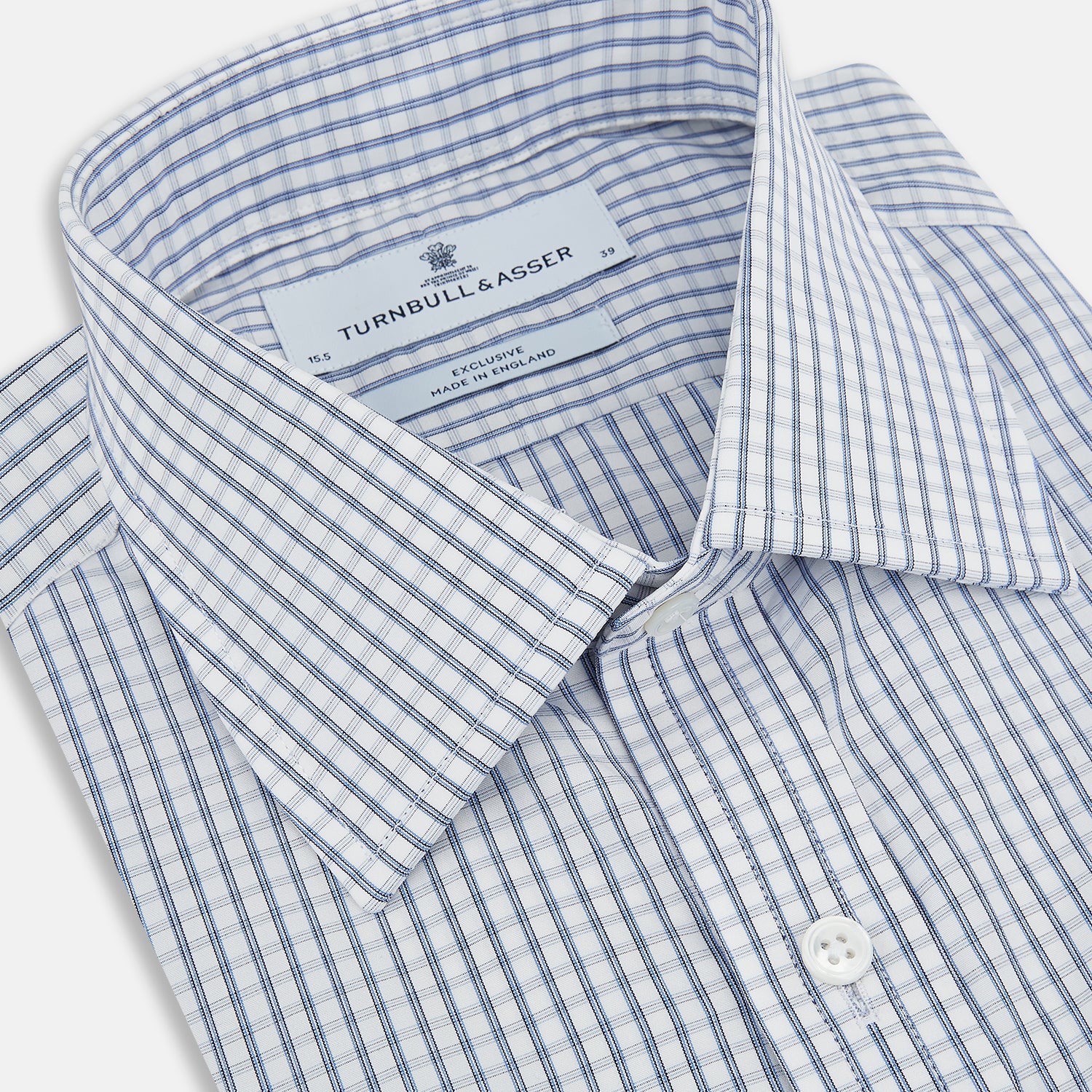 Image 2 of product The Turnbull & Asser Blue Multi Tattersall Check Mayfair Shirt is a long-sleeved, button-down shirt featuring a small blue and white check pattern, pointed collar, and cuffs, shown laid flat on a white background.