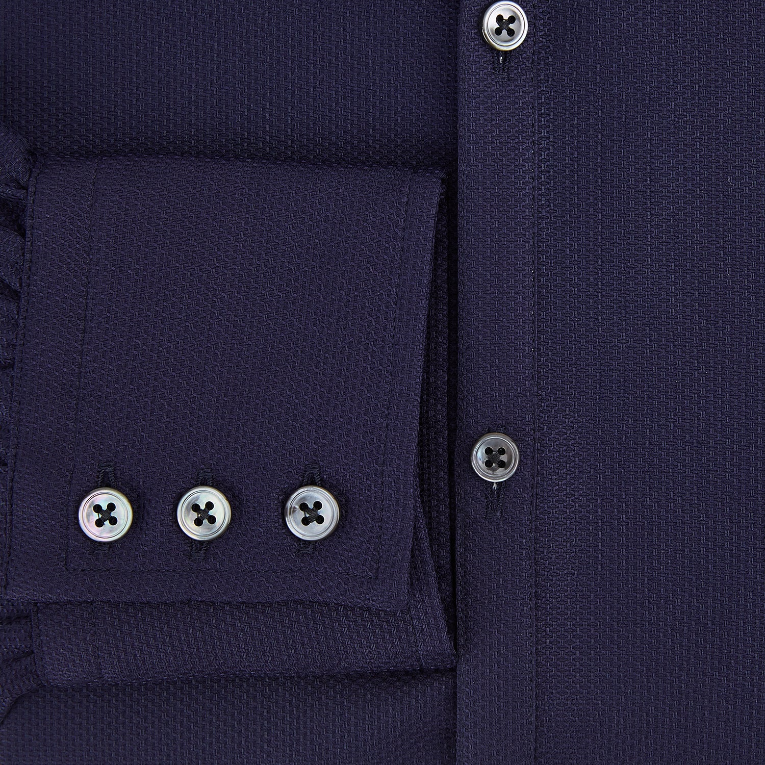 Image 4 of product The Navy Textured Windsor Shirt by Turnbull & Asser features long sleeves, a Windsor collar, buttoned cuffs, and white buttons—a fine example of British craftsmanship—set against a plain white background.