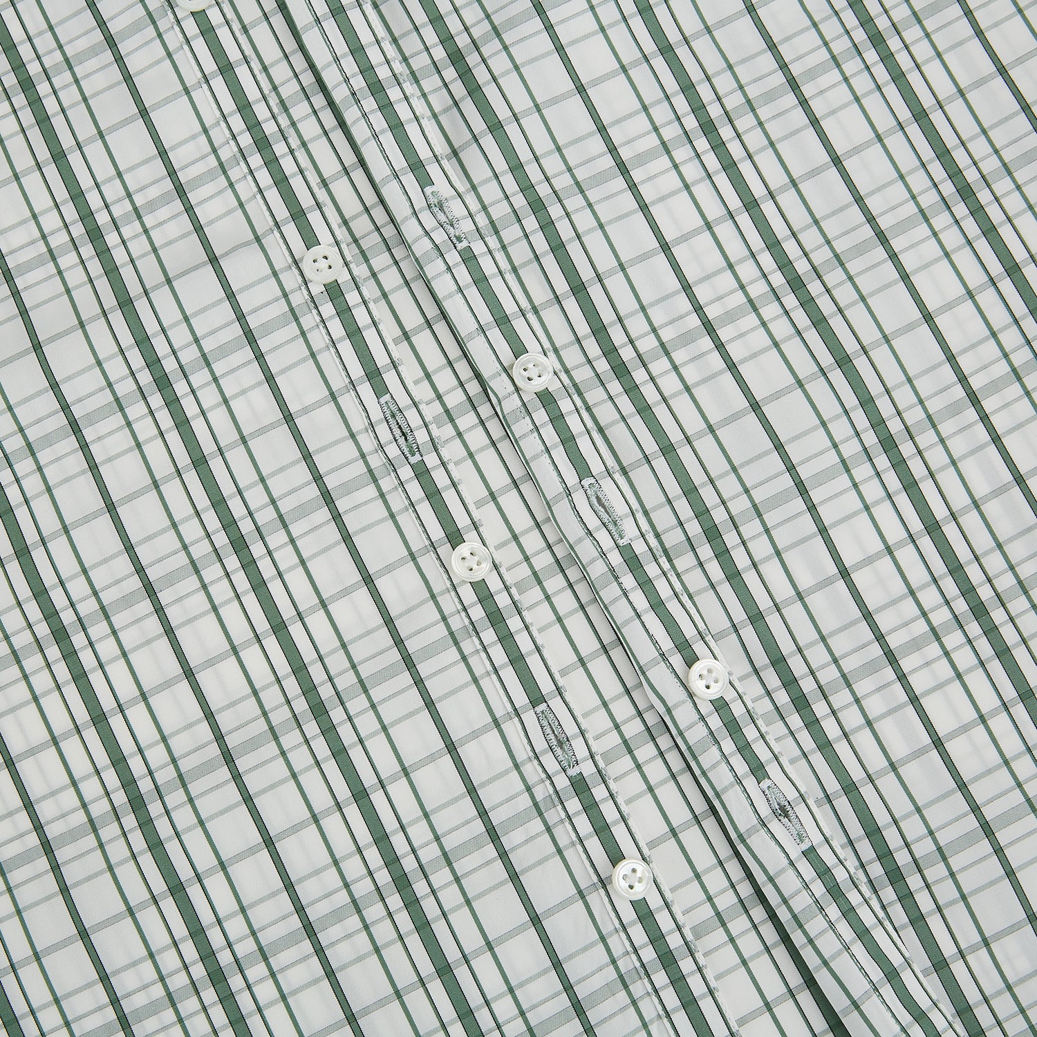 Image 7 of product The Turnbull & Asser Sage Green Plaid Check Westminster Shirt features a collared, long-sleeve button-up design with a white base and sage green plaid pattern, showcasing classic British craftsmanship against a clean white background.