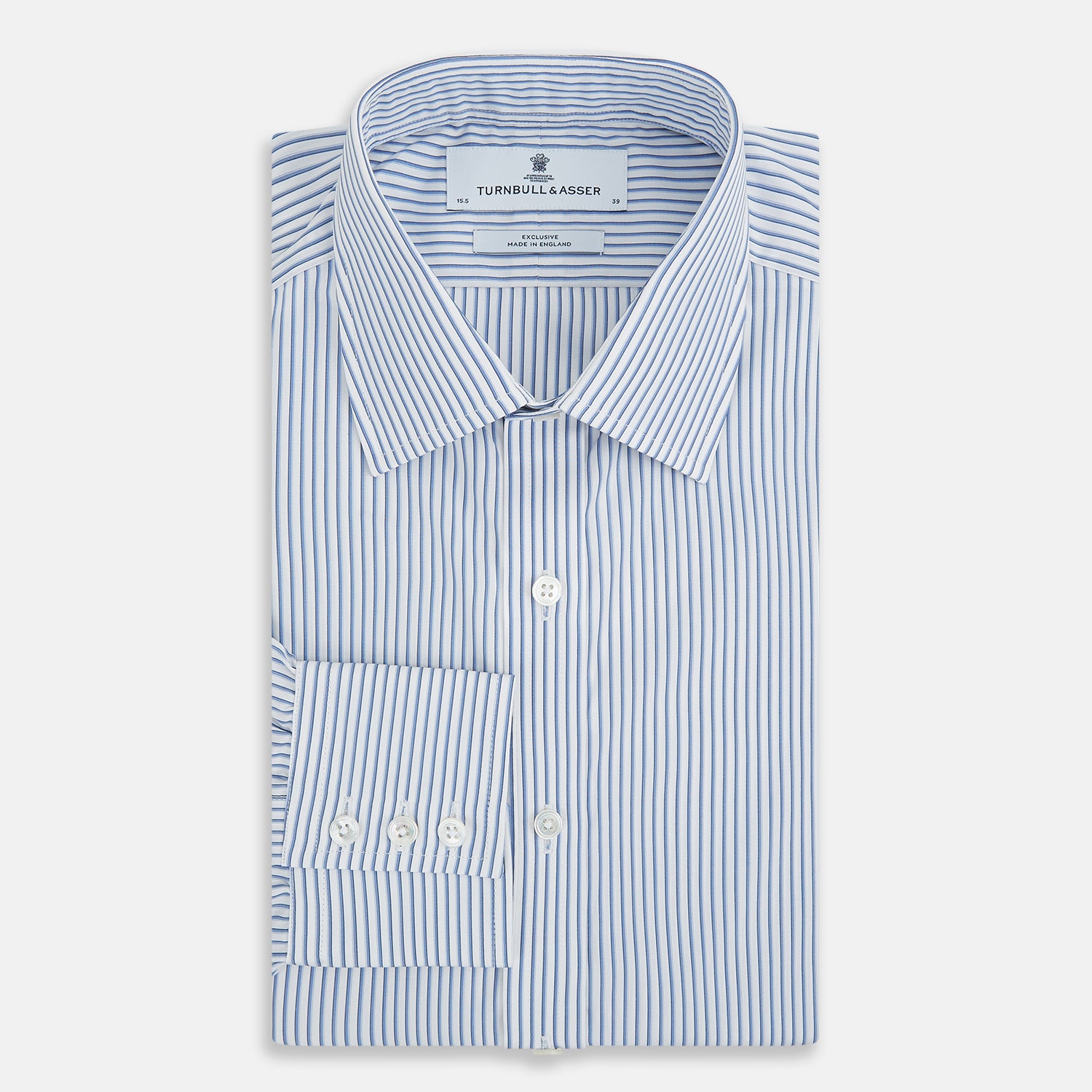 Image 5 of product The Turnbull & Asser Blue Shadow Stripe Mayfair Shirt is a long-sleeve button-up with a T&A collar and thin blue vertical stripes on white, shown on a plain white background.