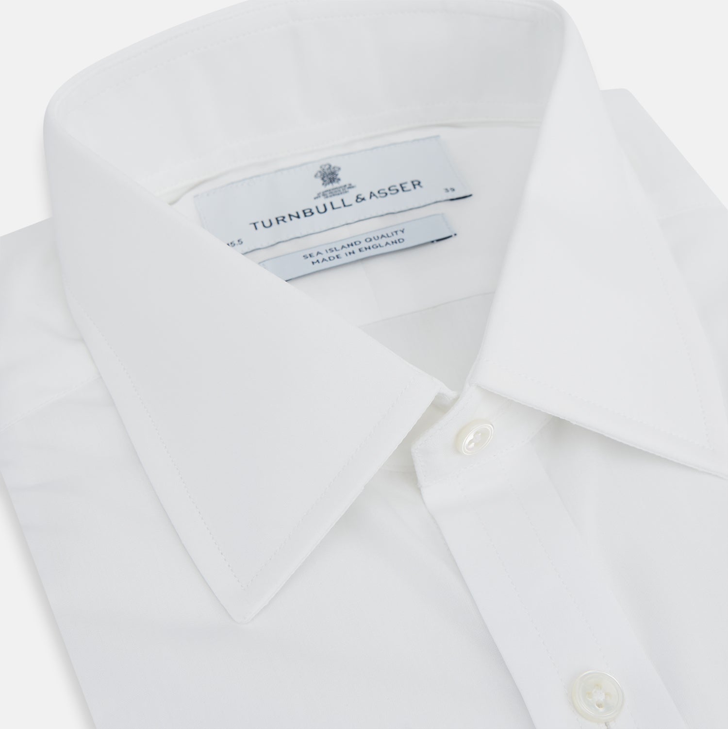 Image 2 of product The Turnbull & Asser White Sea Island Quality Cotton Shirt features a T&A collar and 3-button cuffs, crafted from luxurious cotton and displayed on a white background.