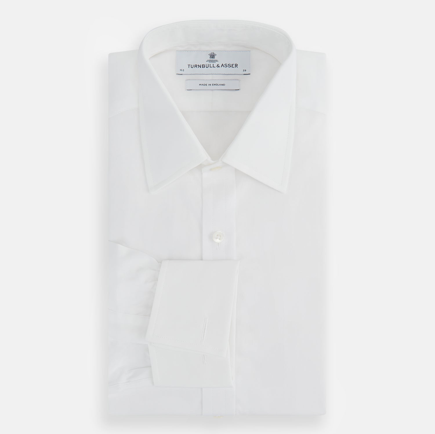 Image 4 of product The Turnbull & Asser Plain White Cotton Shirt features a T&A collar and double cuffs, shown flat on a white background—ideal for pairing with standout ties or achieving a minimalist look.