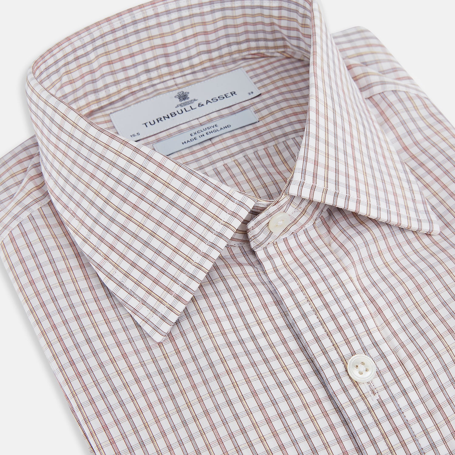 Image 2 of product The Turnbull & Asser Multicoloured Check Mayfair Shirt is a long-sleeve, button-up shirt with a classic collar and buttoned cuffs, showcasing a true British checkered pattern on a white background.
