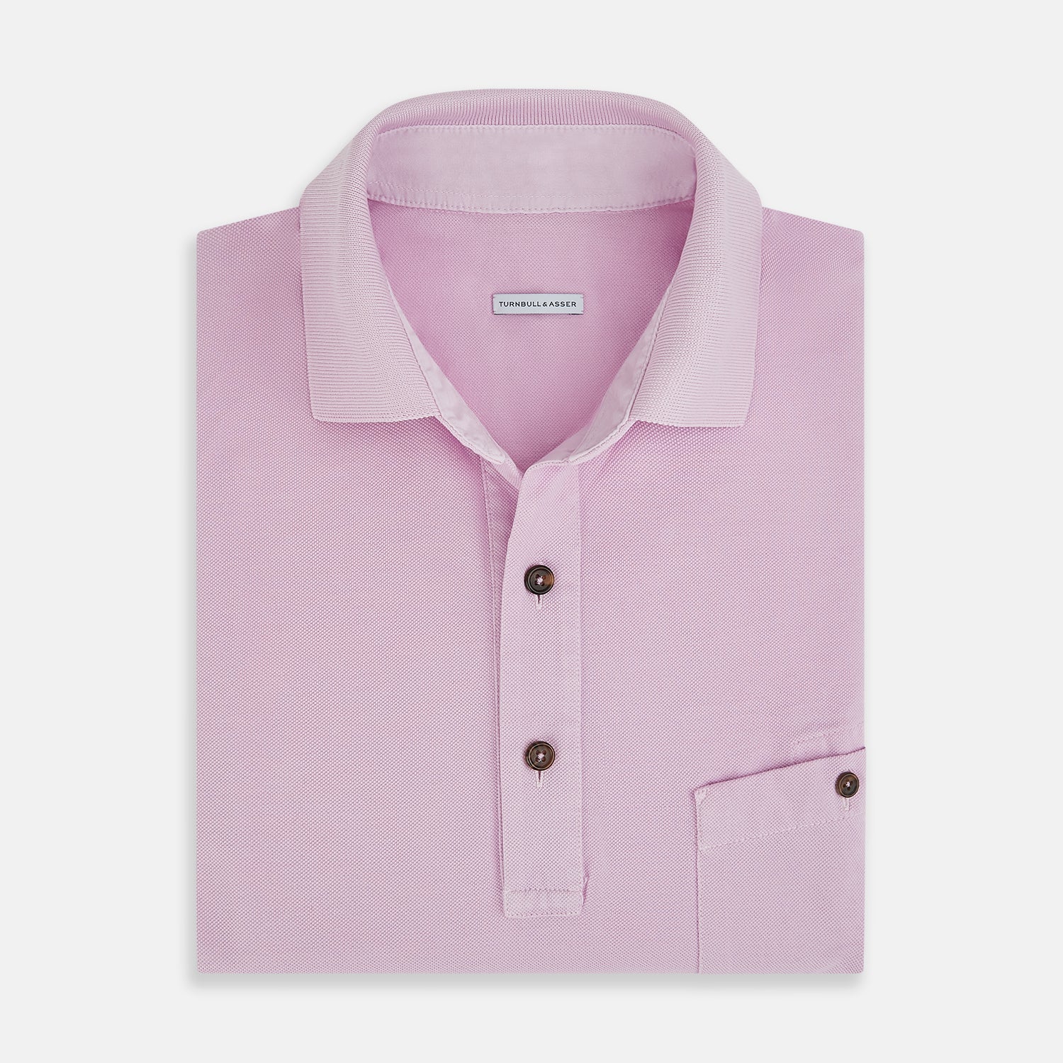Image 4 of product The Turnbull & Asser Pink Polo Shirt is a men's cotton polo with short sleeves, a collar, three dark buttons, and a chest pocket with a button, shown laid flat on a white background.