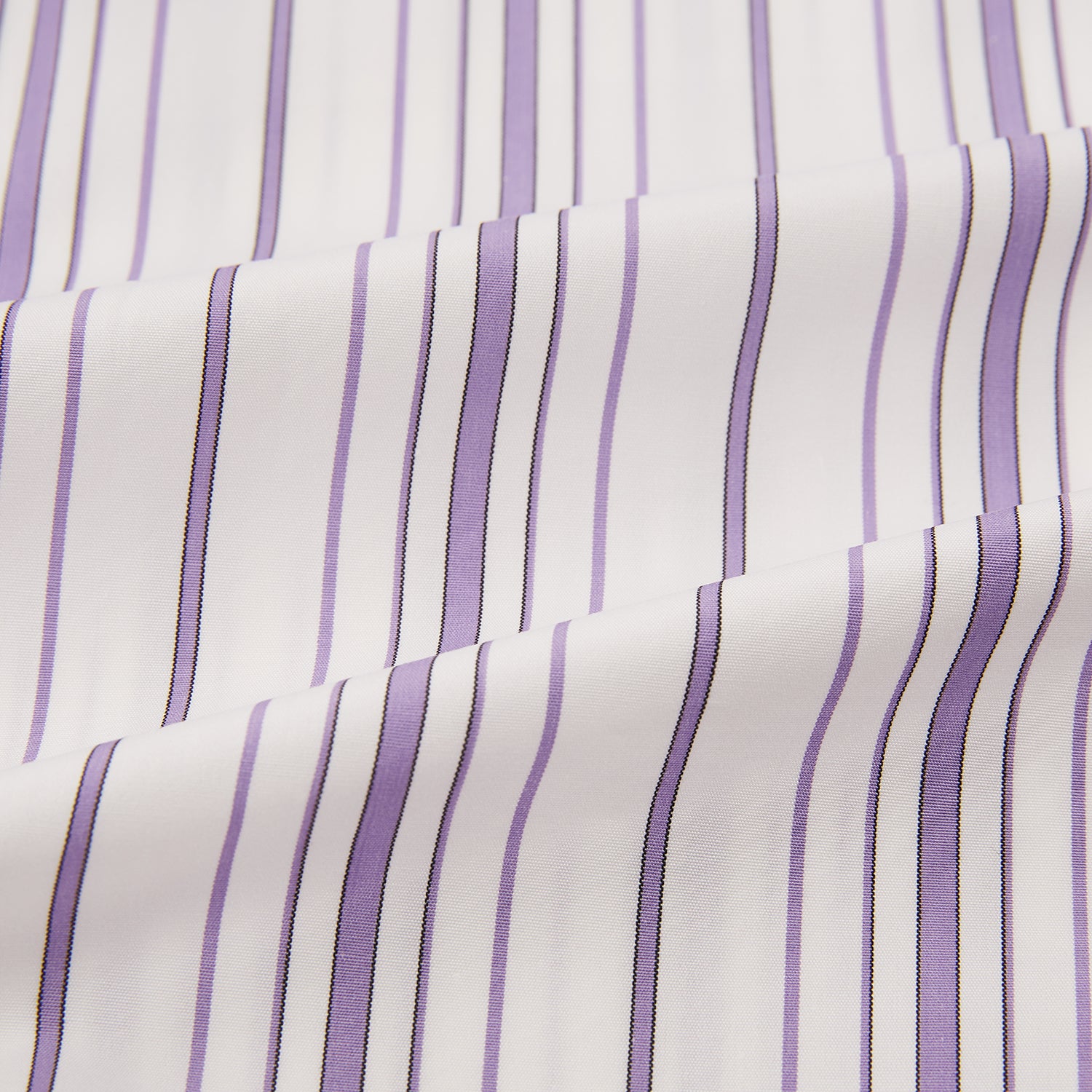 Image 6 of product The Purple Multi Stripe Mayfair Shirt by Turnbull & Asser is a long-sleeve, collared button-up featuring vertical blue and purple stripes on white, ideal for formal occasions. The shirt is neatly displayed flat against a white background.
