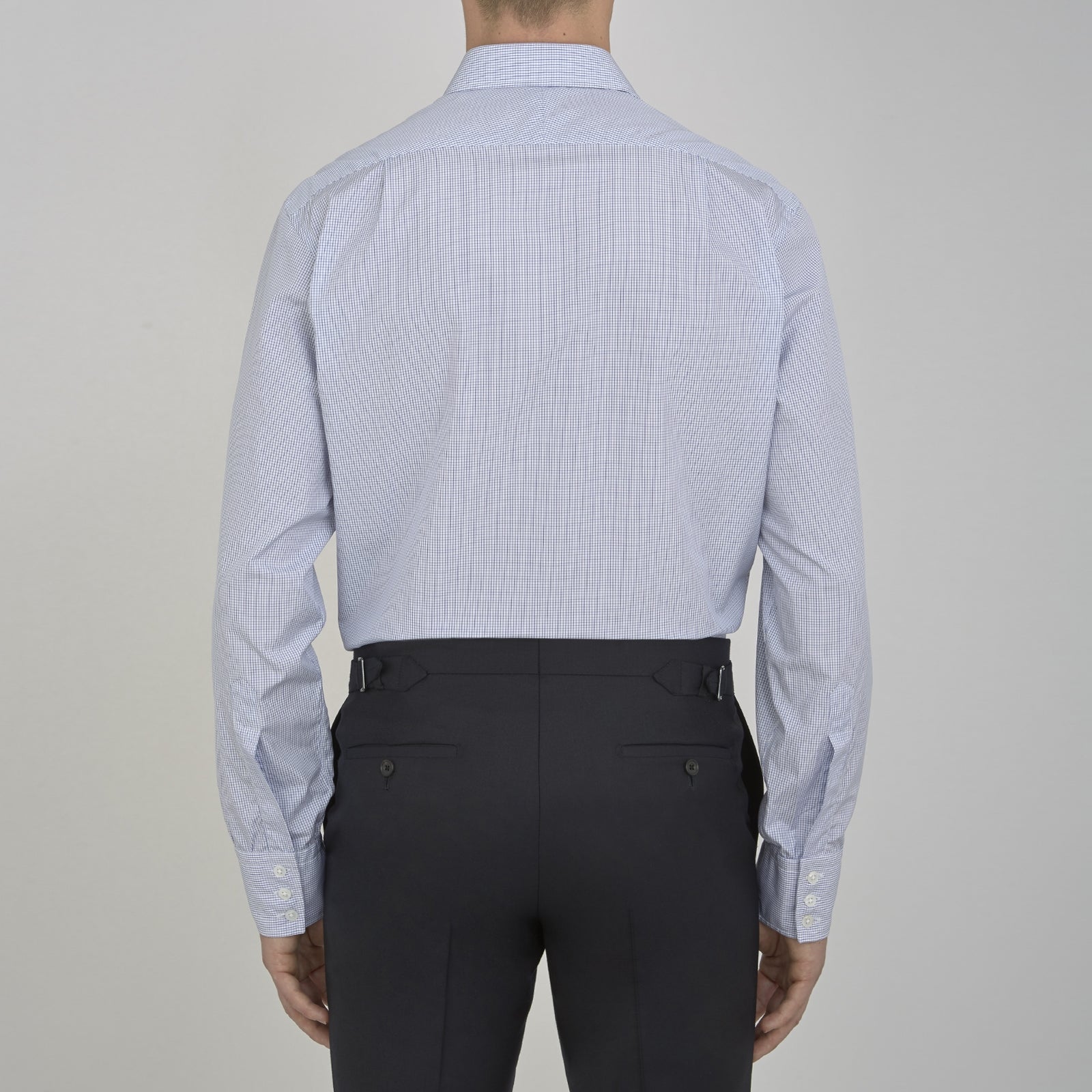 Image 5 of product A neatly folded Turnbull & Asser Blue Grid Check Shirt features a T&A collar, 3-button cuffs, white buttons, and subtle British style. The blue and white check cotton design displays the brand label inside the collar.