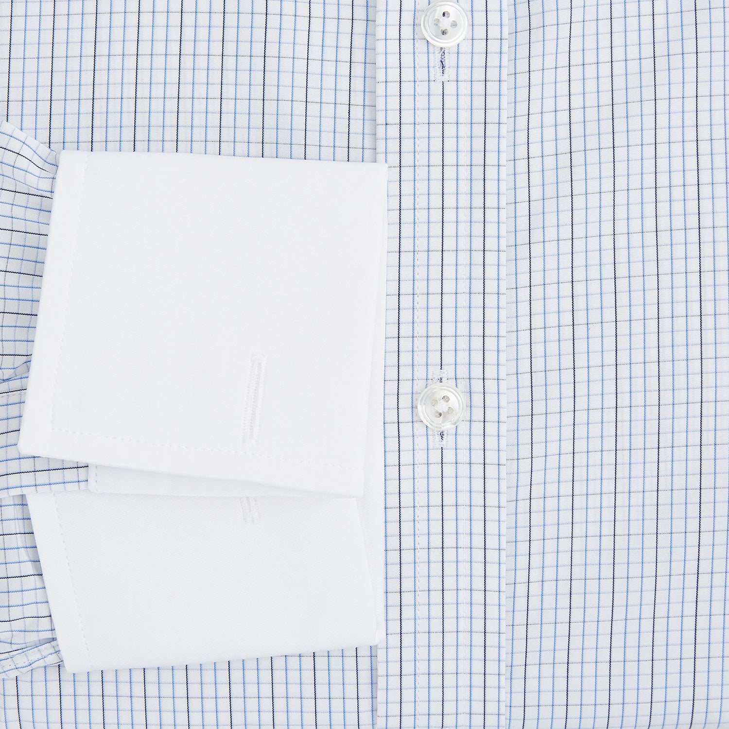 Image 4 of product The Turnbull & Asser Pale Blue and Navy Grid Check Shirt features a contrast T&A collar and cuffs, long sleeves, and a button-down front, all displayed on a plain white background.