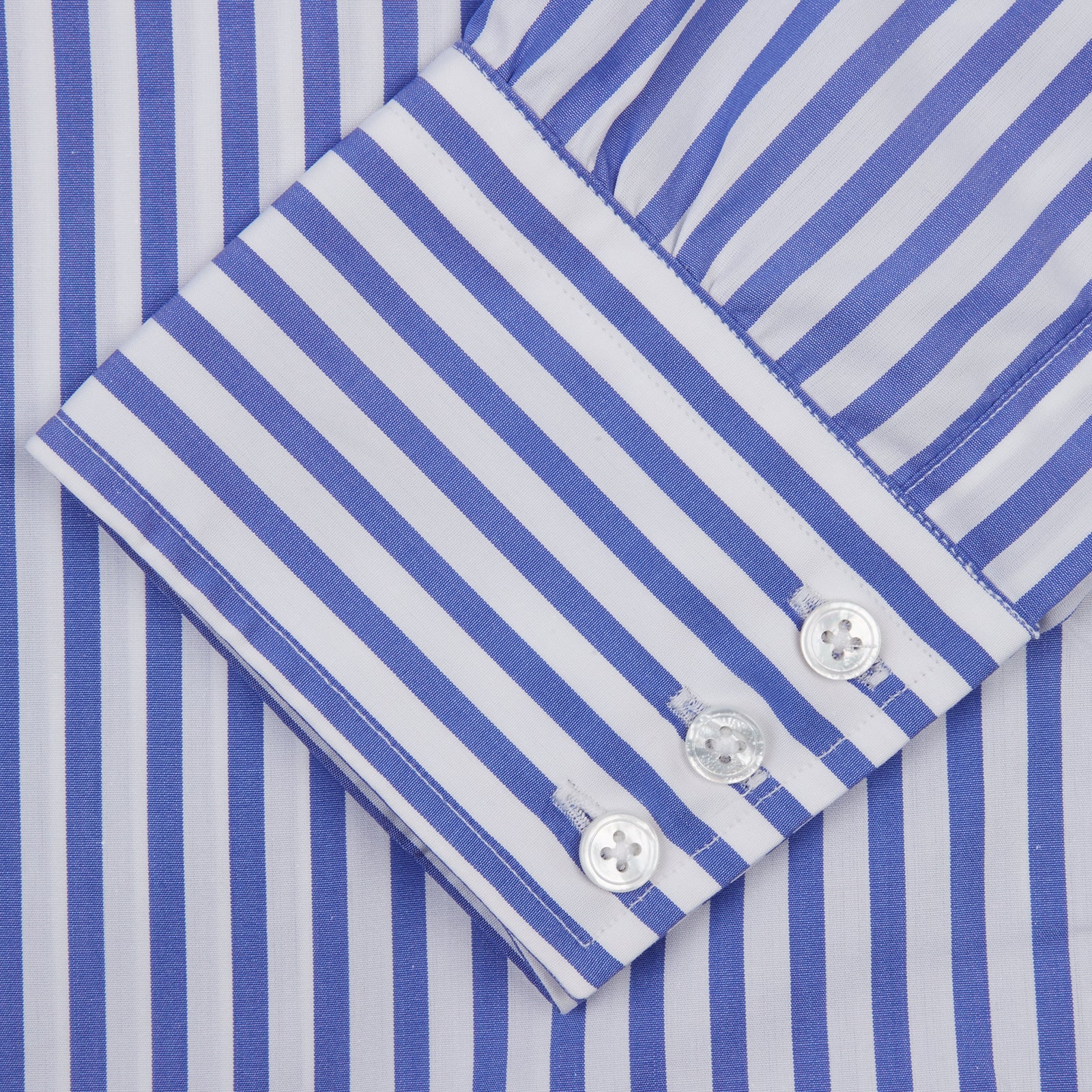 Image 3 of product The Turnbull & Asser Blue and White Candy Stripe Shirt features a T&A collar and 3-button cuffs, shown neatly folded on a plain white background.