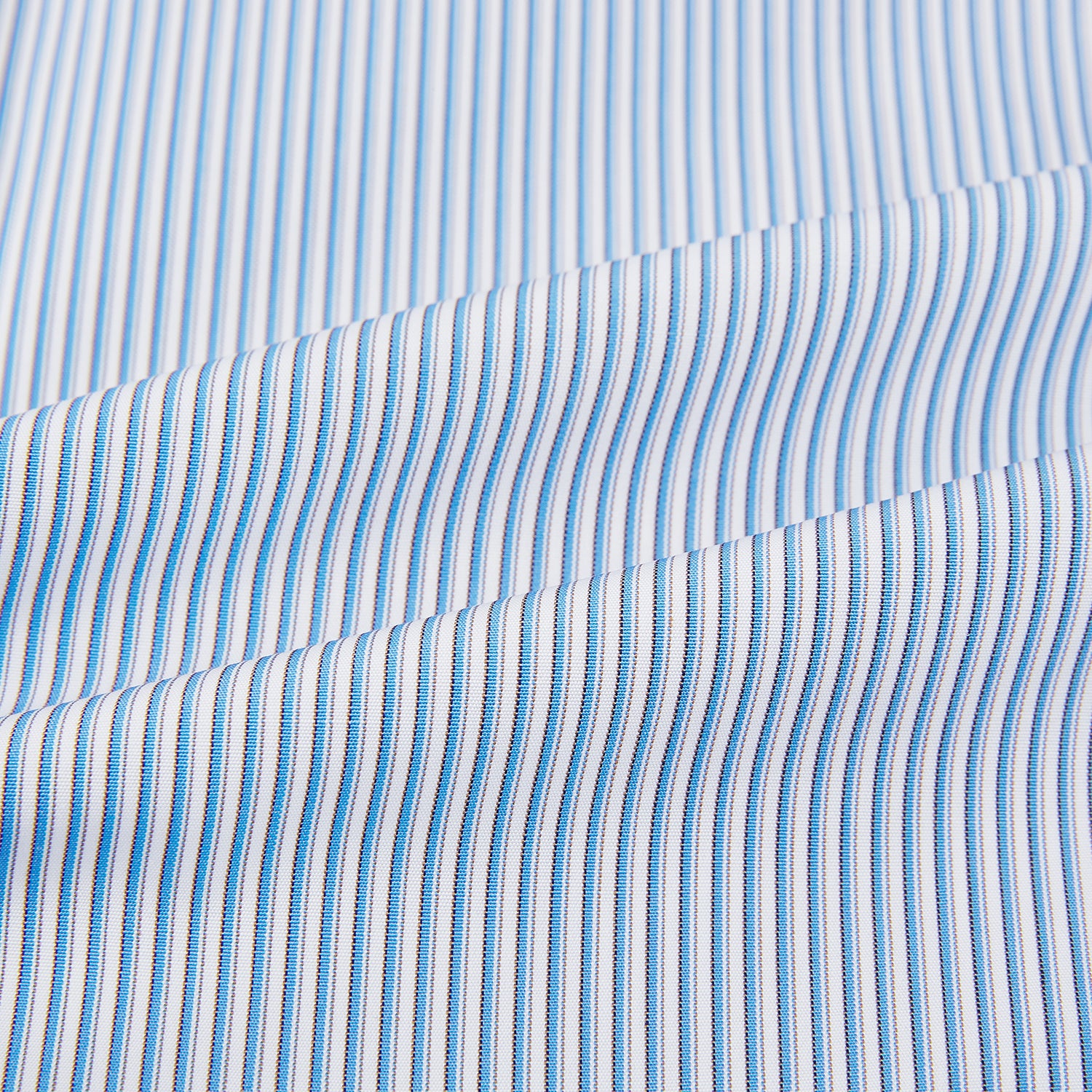 Image 6 of product The Turnbull & Asser Pale Blue Pinstripe Mayfair Shirt features pale blue pinstripes, a classic T&A collar, white buttons, and cuffed sleeves, shown against a plain white background.