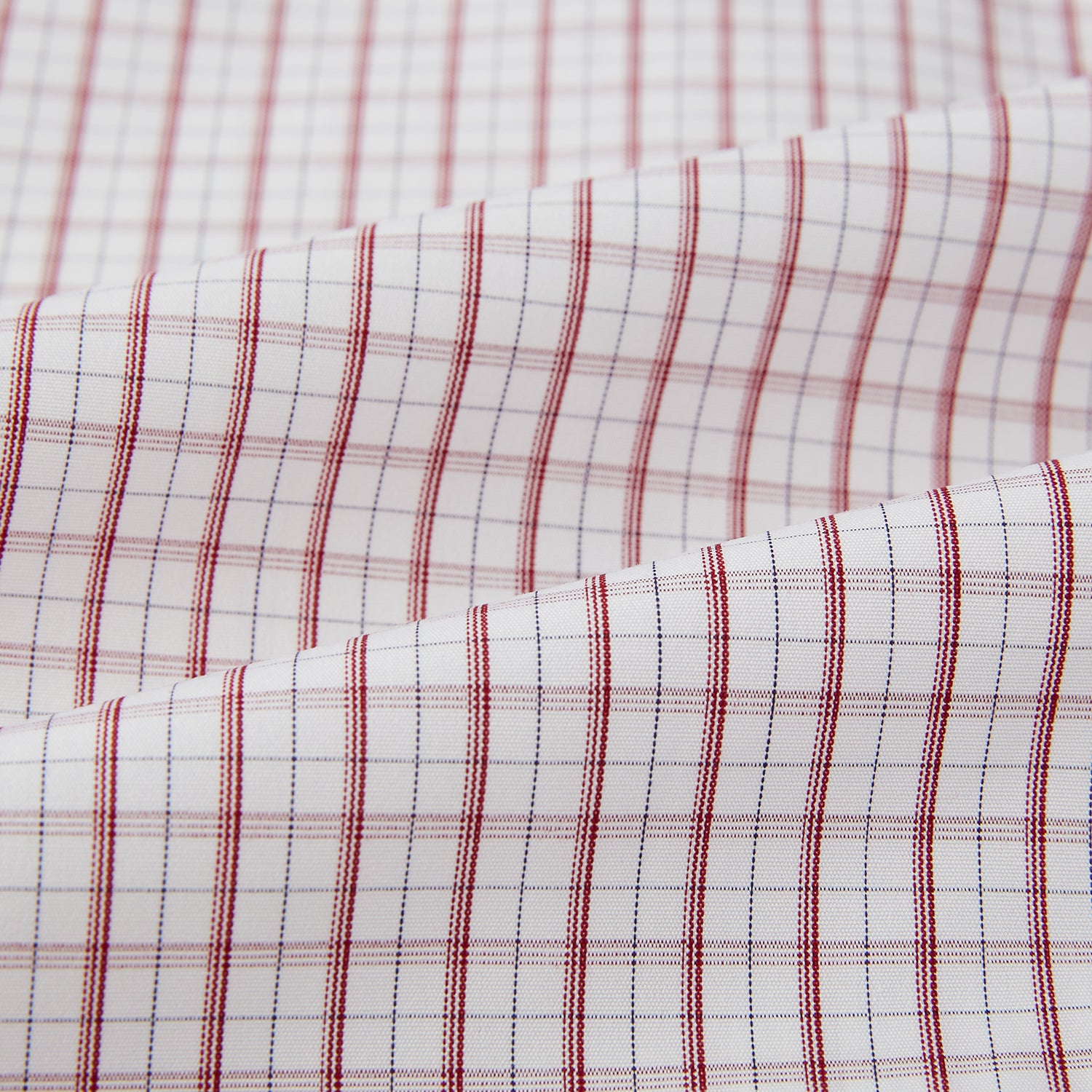 Image 6 of product The Turnbull & Asser Red Tattersall Check Mayfair Shirt features long sleeves, a collar, and Italian cotton with a red tattersall check on white, shown flat against a white background.