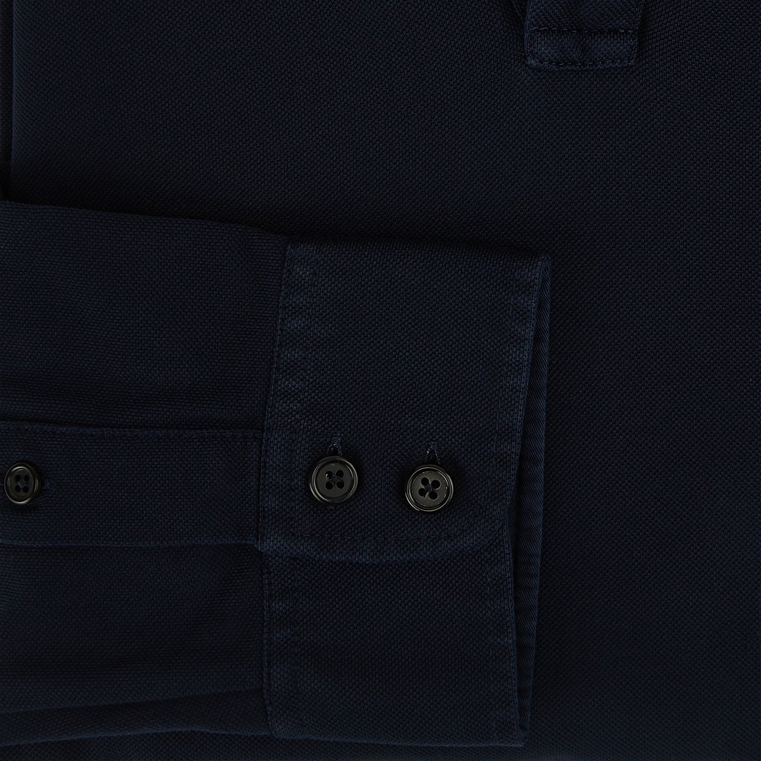 Image 4 of product A Navy Rugby Polo Shirt by Turnbull & Asser, featuring long sleeves and a collar, is displayed flat on a white background. The design is simple and free of visible logos or patterns.