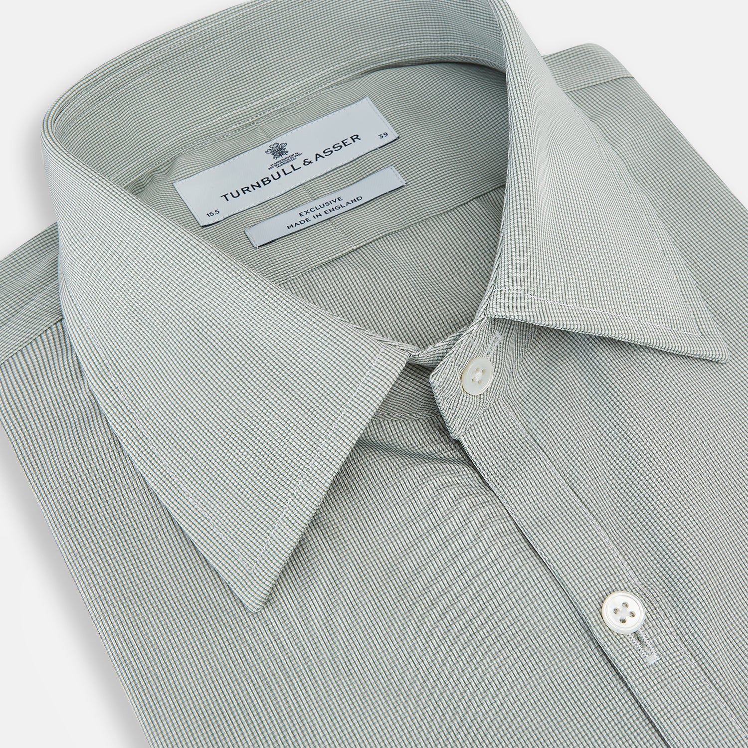 Image 2 of product A dark green micro graph check Westminster shirt by Turnbull & Asser, featuring fine British craftsmanship, a Turnbull collar, and white buttons, is laid flat on a white background.
