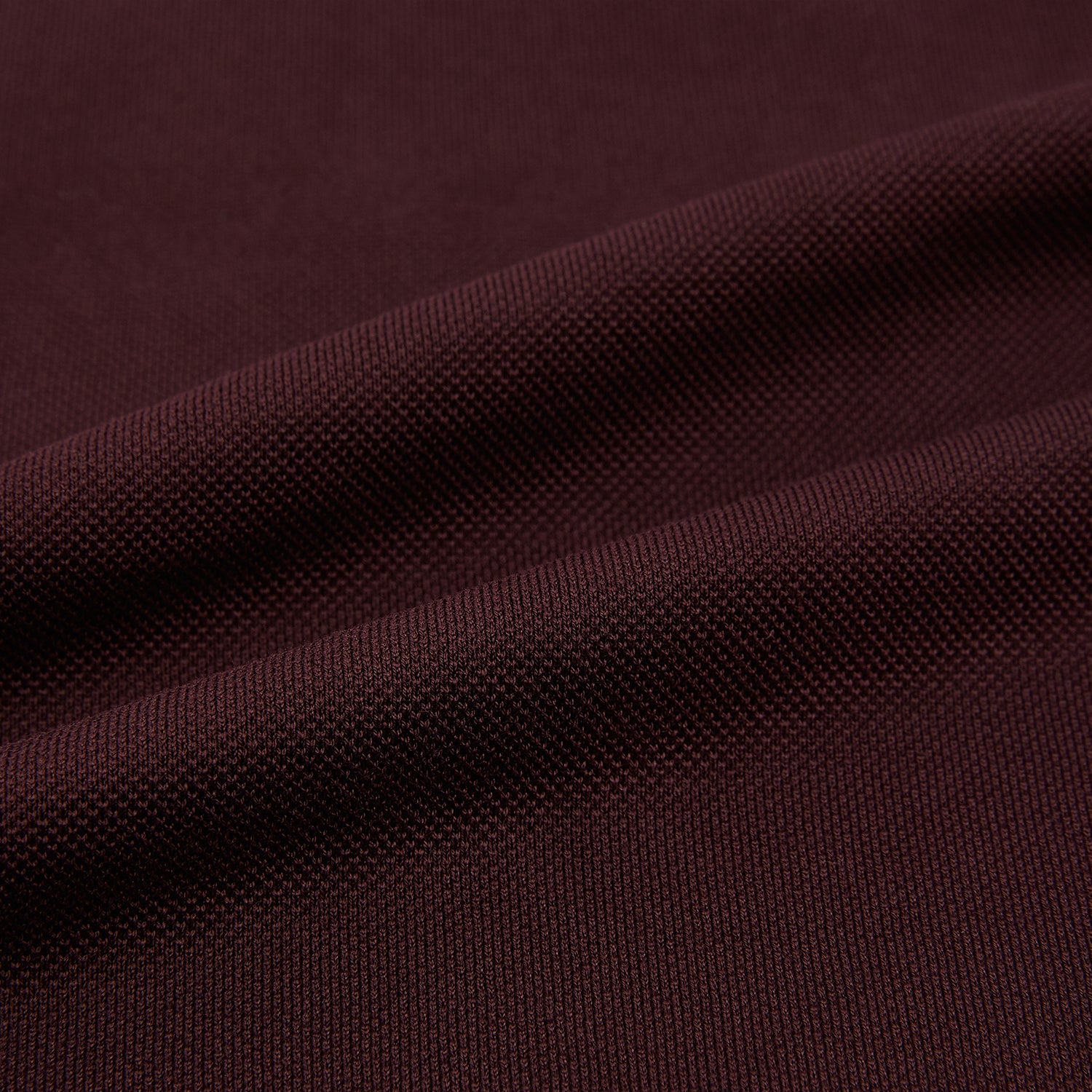 Image 6 of product The Turnbull & Asser Burgundy Rugby Polo Shirt is a long-sleeve, pure cotton collared top with no visible buttons, shown laid flat on a white background.