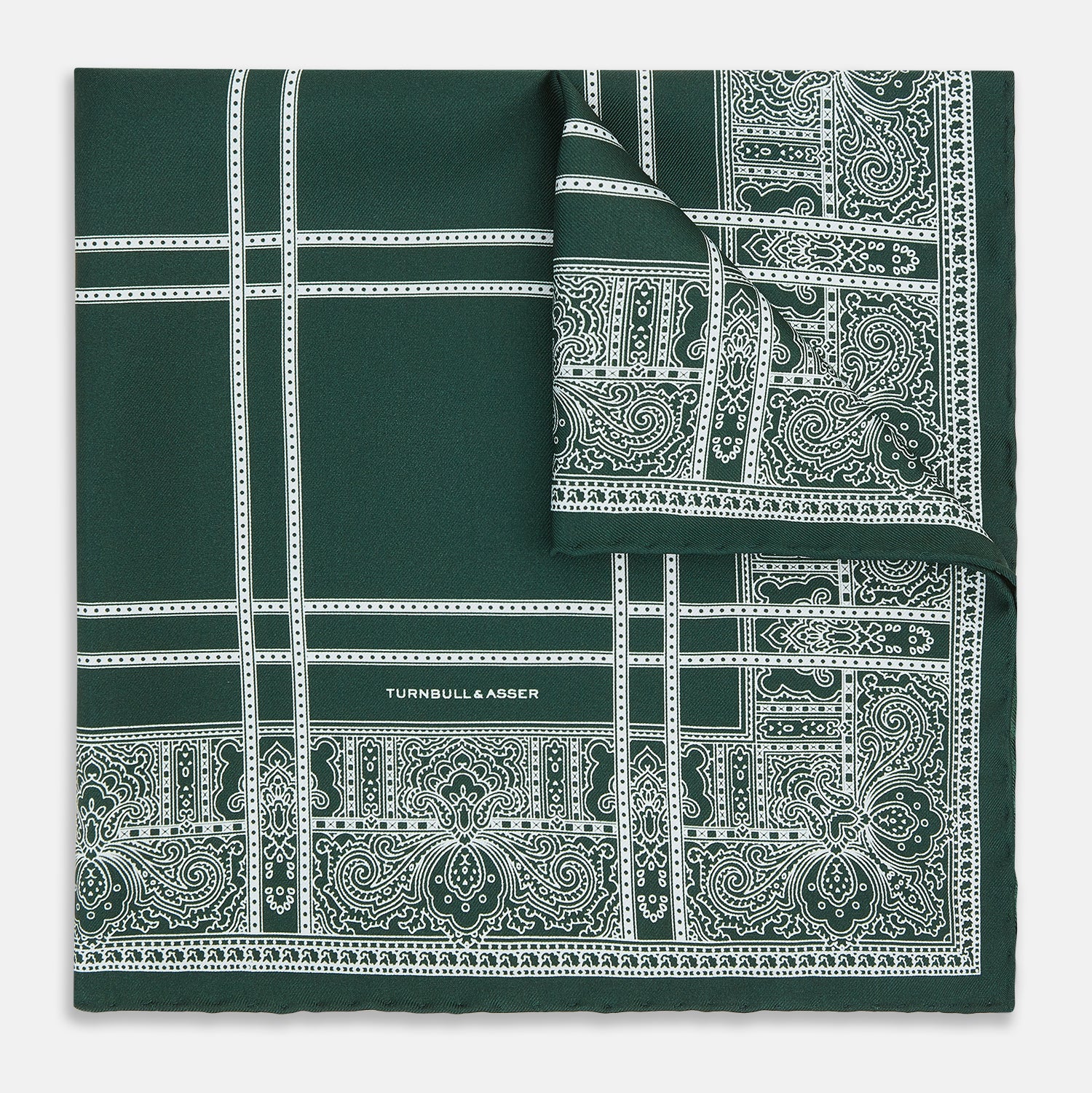 Image 1 of product Turnbull & Asser’s Forest Green Paisley Bandana Patterned Silk Pocket Square is handcrafted in England, featuring an intricate white geometric and paisley design with the brand name printed in one corner.