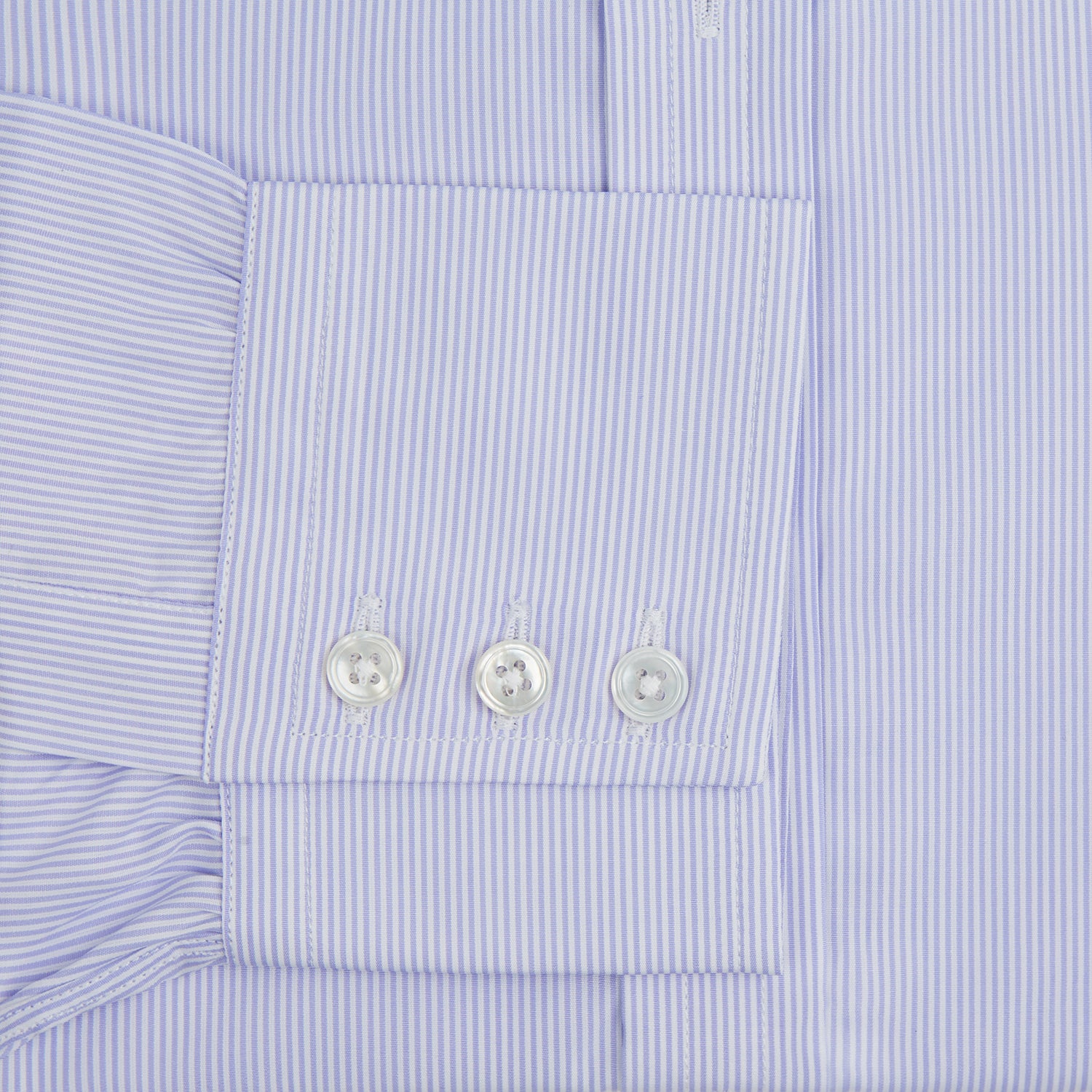 Image 4 of product A Blue and White Fine Bengal Stripe Sea Island Quality Cotton Shirt by Turnbull & Asser, featuring a T&A collar and 3-button cuffs, is laid flat on a white background.